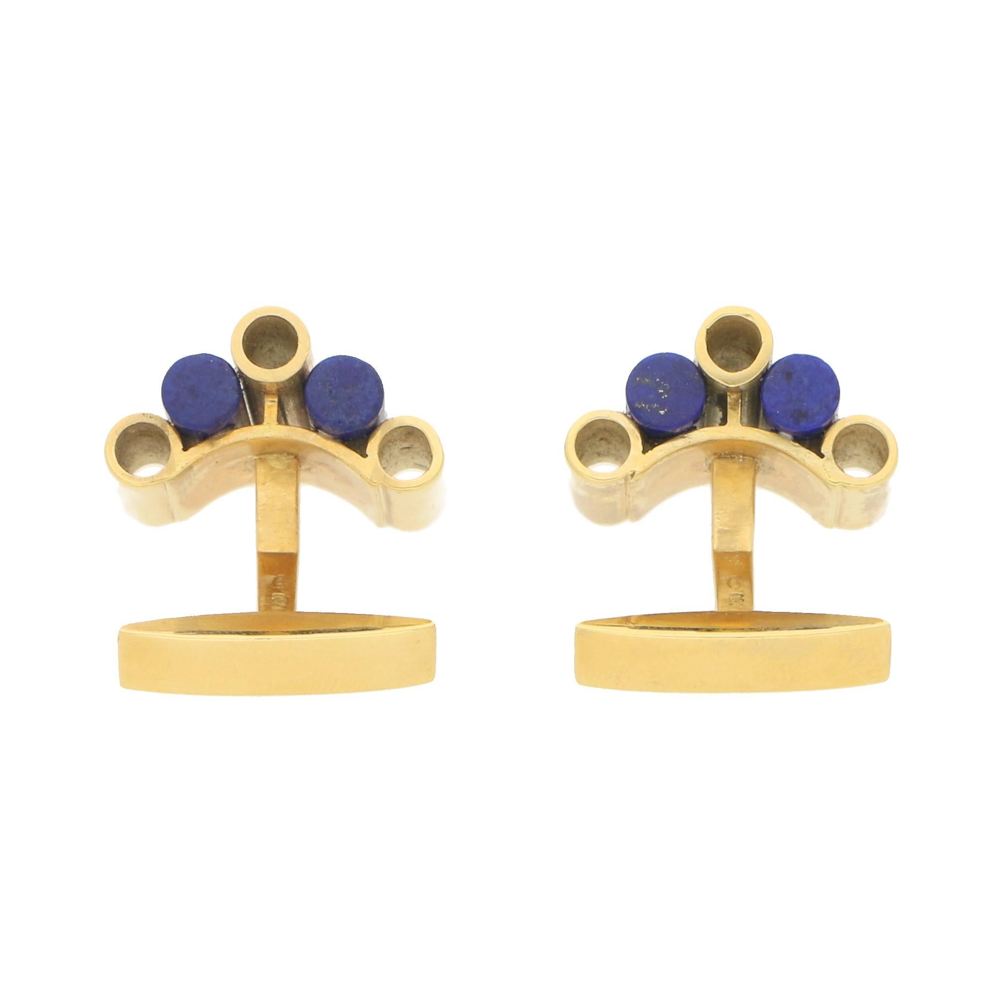 A lovely pair of Art Deco inspired lapis lazuli cufflinks set in 18k Yellow Gold, circa 1940.

Each cufflink is set with two baton shaped lapis lazuli bars with similar yellow gold batons to each side. The baton's graduate in size creating this
