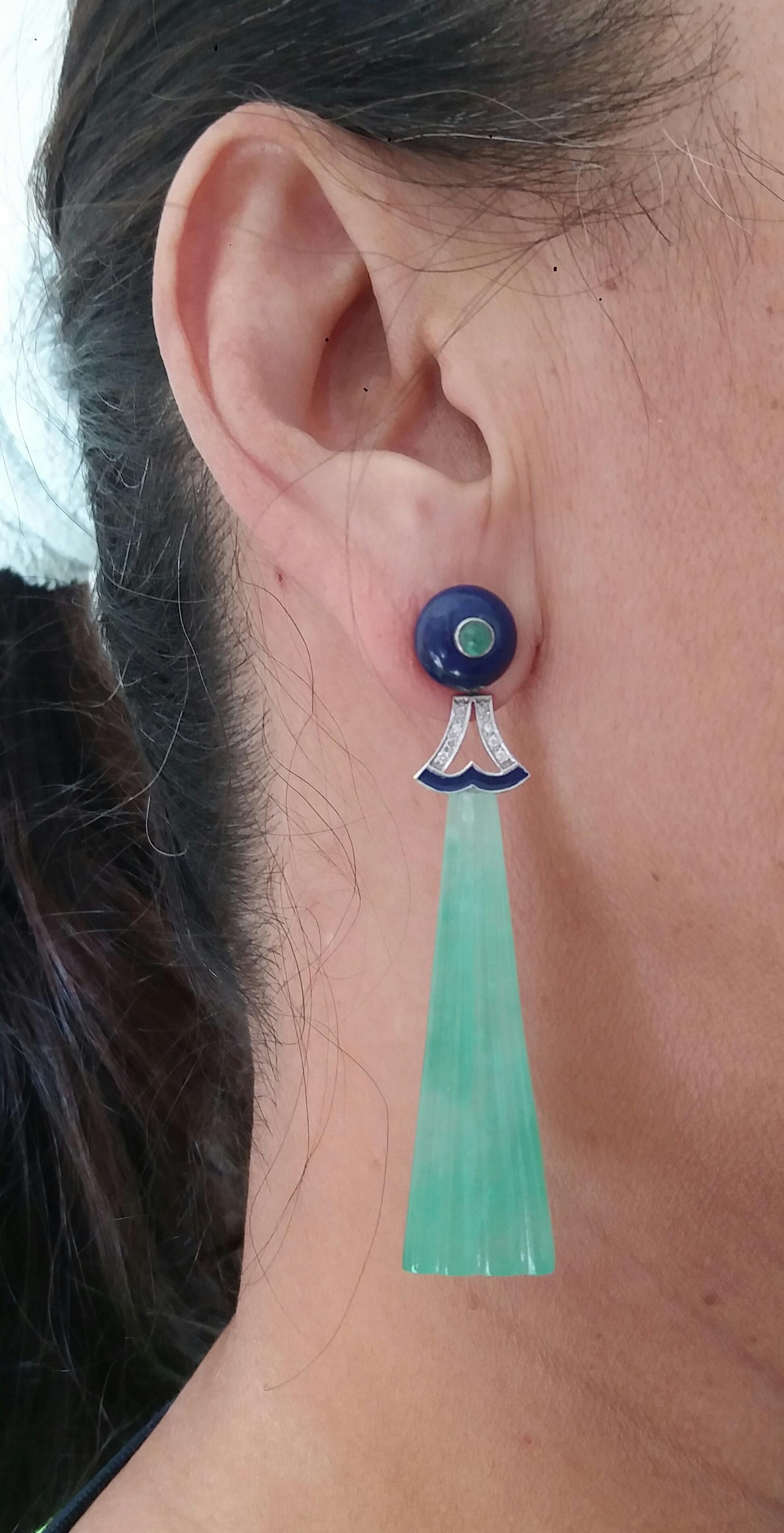 On the top of these classy Art Deco Style Earrings we have 2 round Lapis Lazuli buttons with small Emerald round cabs in the center , middle parts with 2 white gold elements ,16 round full cut diamonds,blue enamel,then in the lower parts we have 2