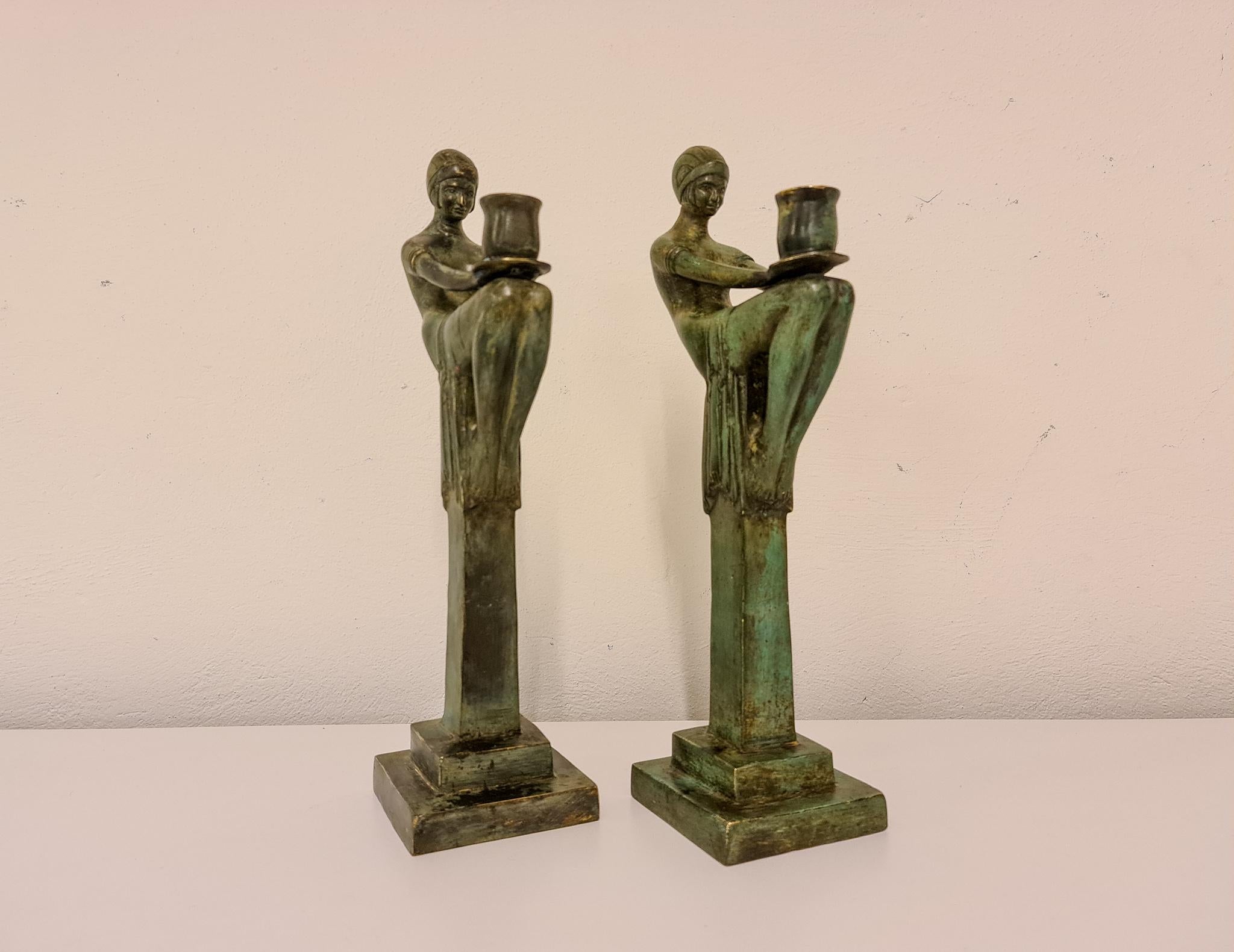 These patinated bronze candelabras in high quality Art Deco style was manufactured in Sweden during the 1990s. 
The large and heavy structure with its quality Art Deco lines. 

Particularly good vintage condition. 

Measures: H 41 cm base 11 x