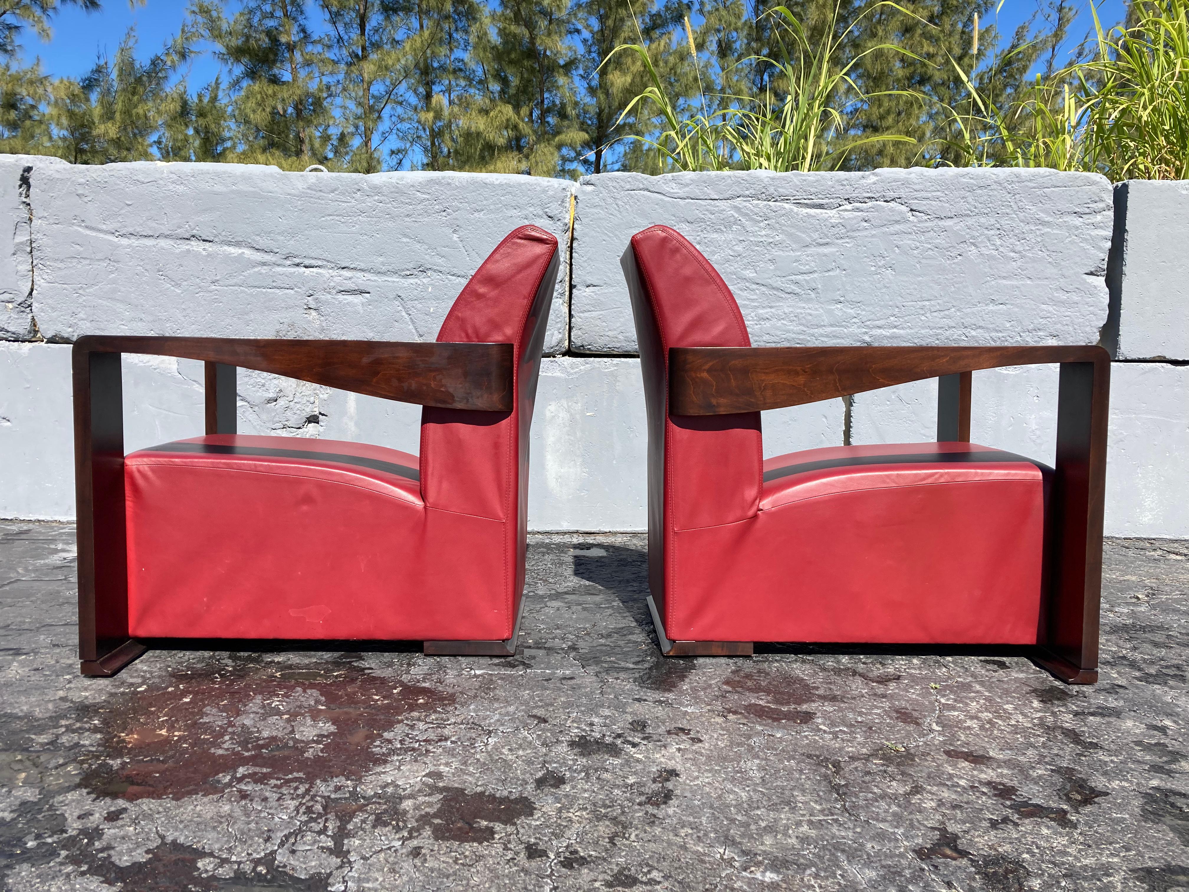 Art Deco style lounge chairs, red leather and wood veneer. Leather and wood has some normal wear.