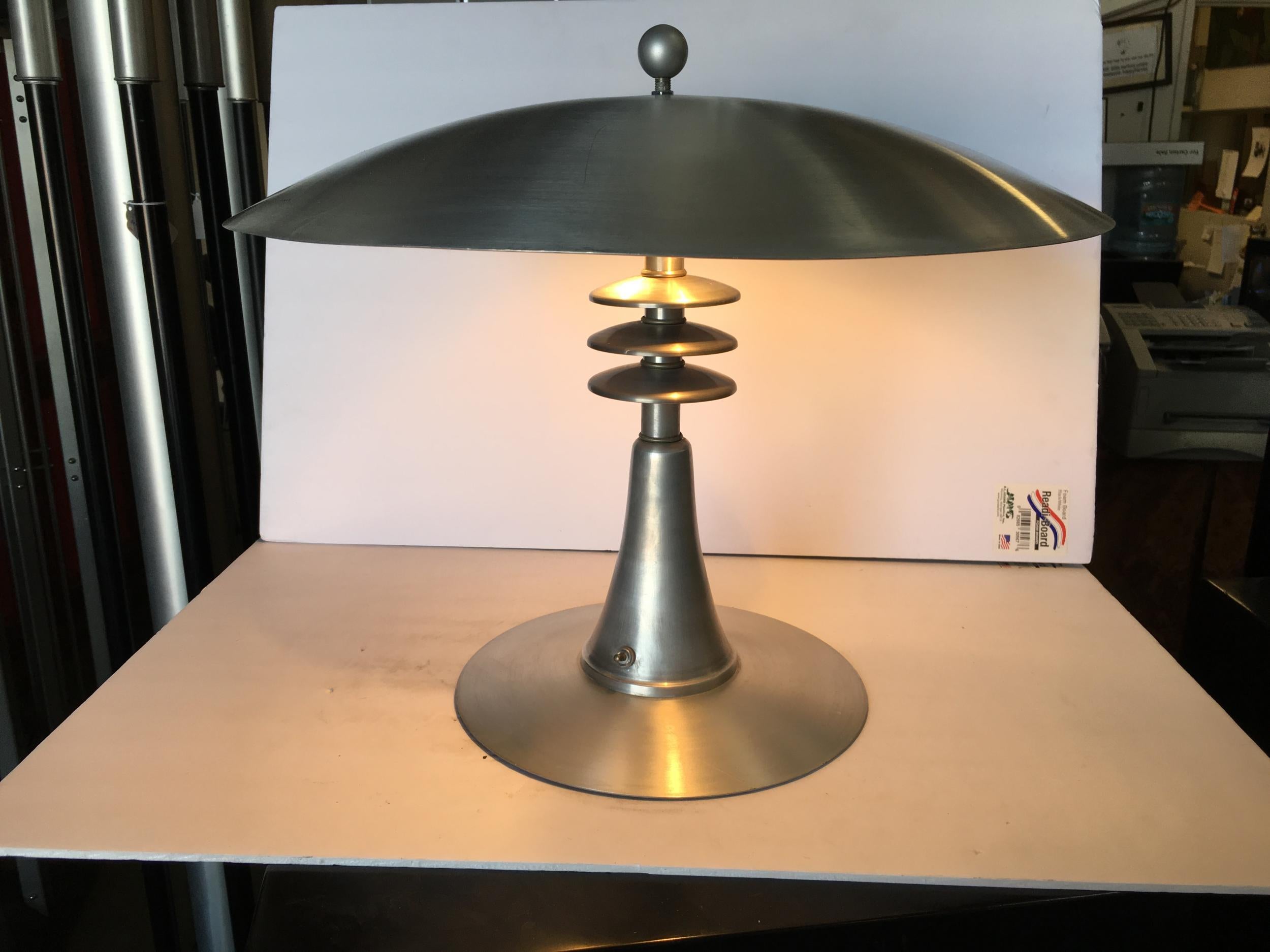 This stunning aluminum Art Deco style table lamp features a large 20