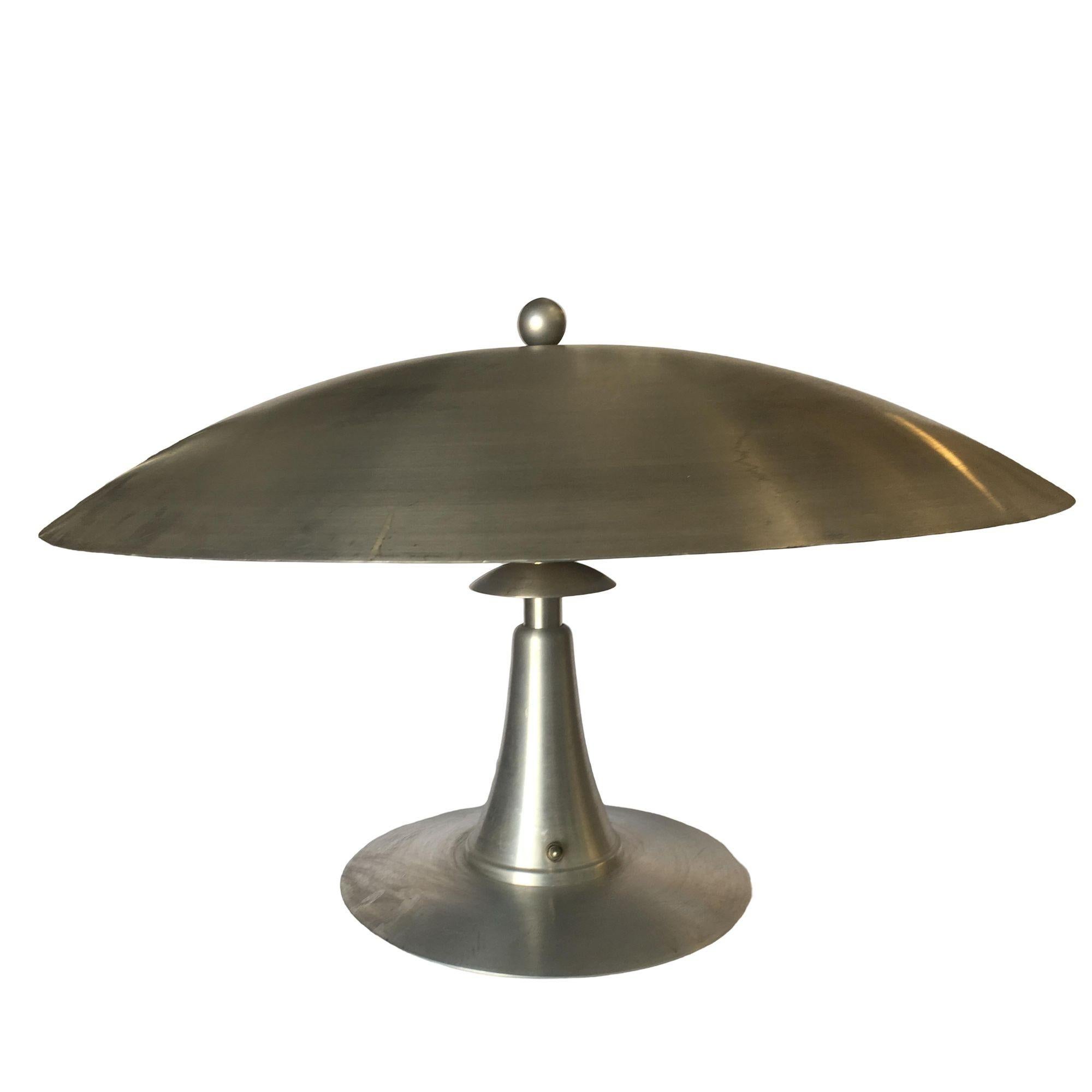 This stunning aluminum Art Deco style table lamp features a large 23