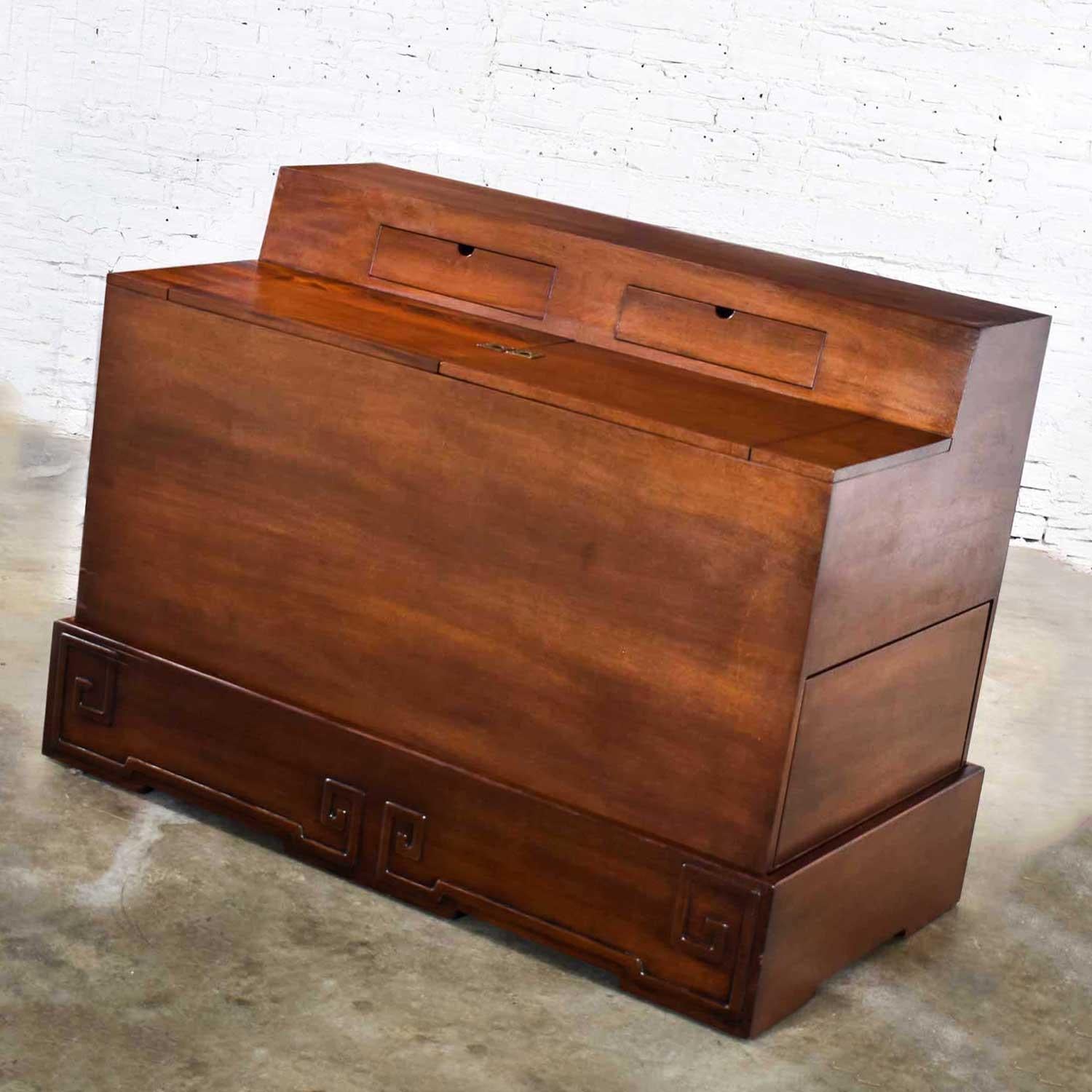 Wonderful Art Deco style entry desk or bar by IMA S.A. Bogota, Colombia comprised of mahogany, mahogany veneer, laminate, brass hinges, and brass ring pulls. Gorgeous condition with wear as you would expect with a vintage piece but no outstanding