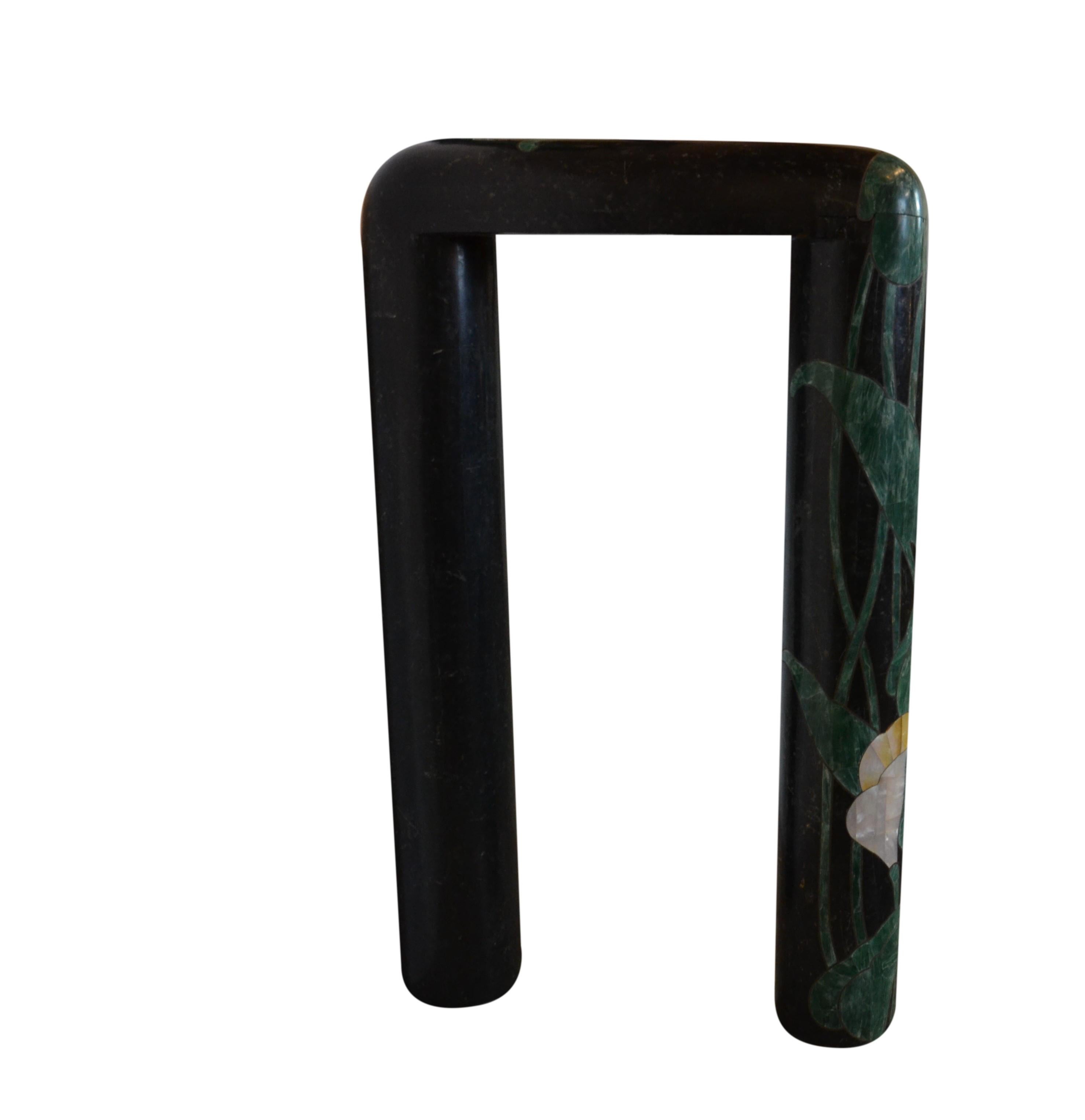 A very decorative tessellated marble console table and mirror in the Art Deco style. Inlaid Water Lily Design using mother of pearl and a green tessellated marble. The design edged with brass.
Measures: Mirror 33.5