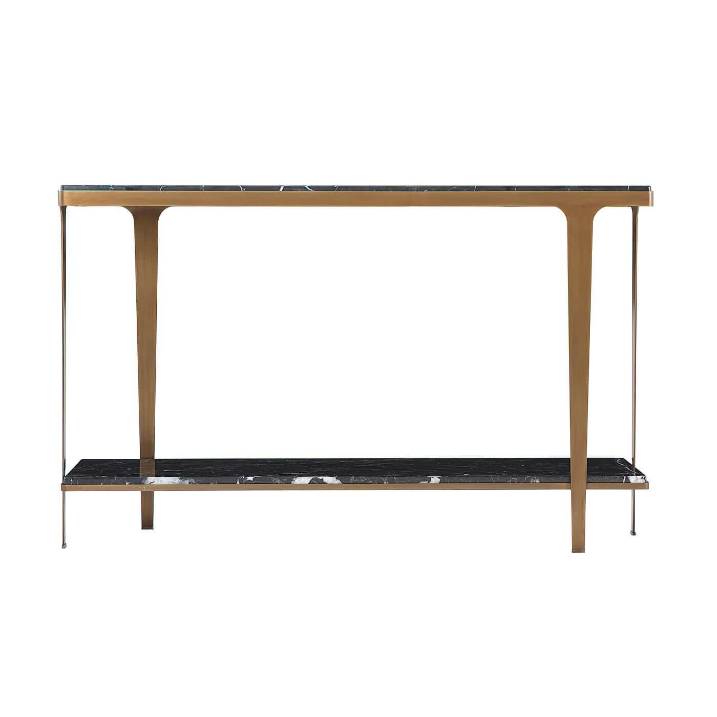 An Art Deco style marble top console with a brushed brass finish steel base with tapered legs and a marble top shelf stretcher base.

Dimensions: 54