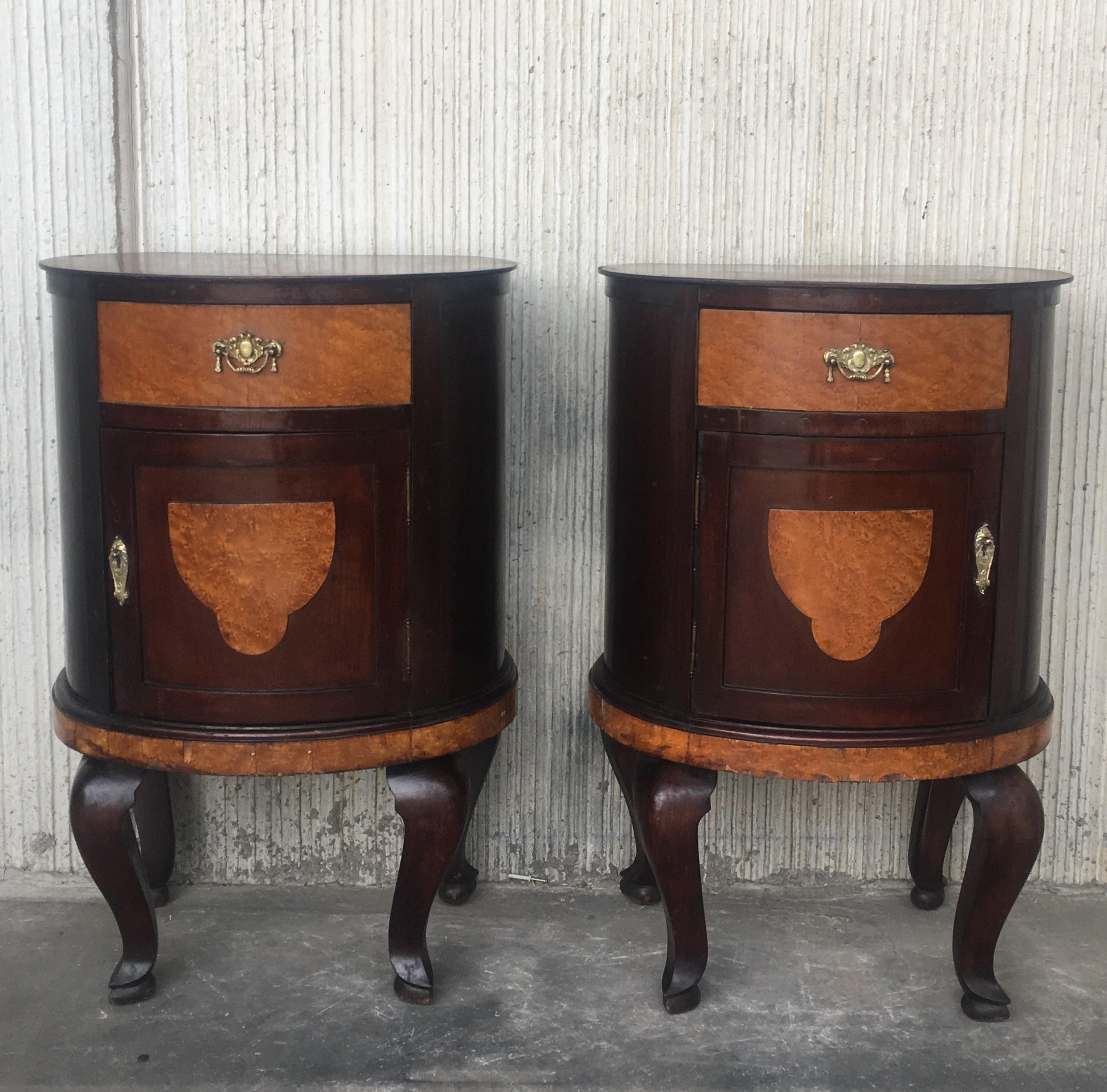 Pair of marquetry nightstands with metal crest one drawer and one compartment.
Originals handles and garniture.

Measures: Height to the table 30.75 in
Total Height 39.75 in.
   