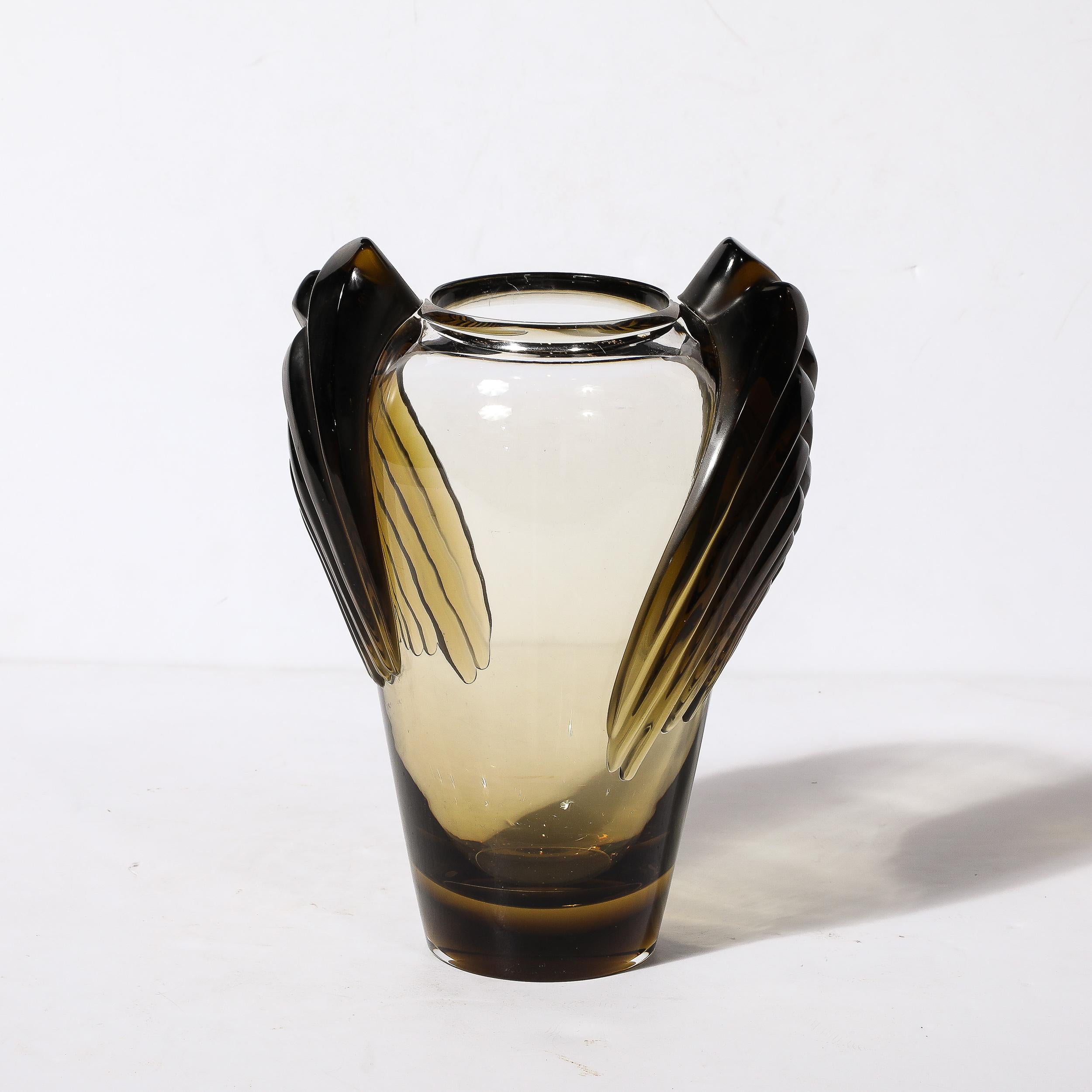 This stunning Art Deco Style Marrakech Vase is signed Lalique and originates from France, designed in 1978. This Art Deco inspired vase sports a teardrop form body with tiered and interlaced geometric wings to either side hugging the curvature and