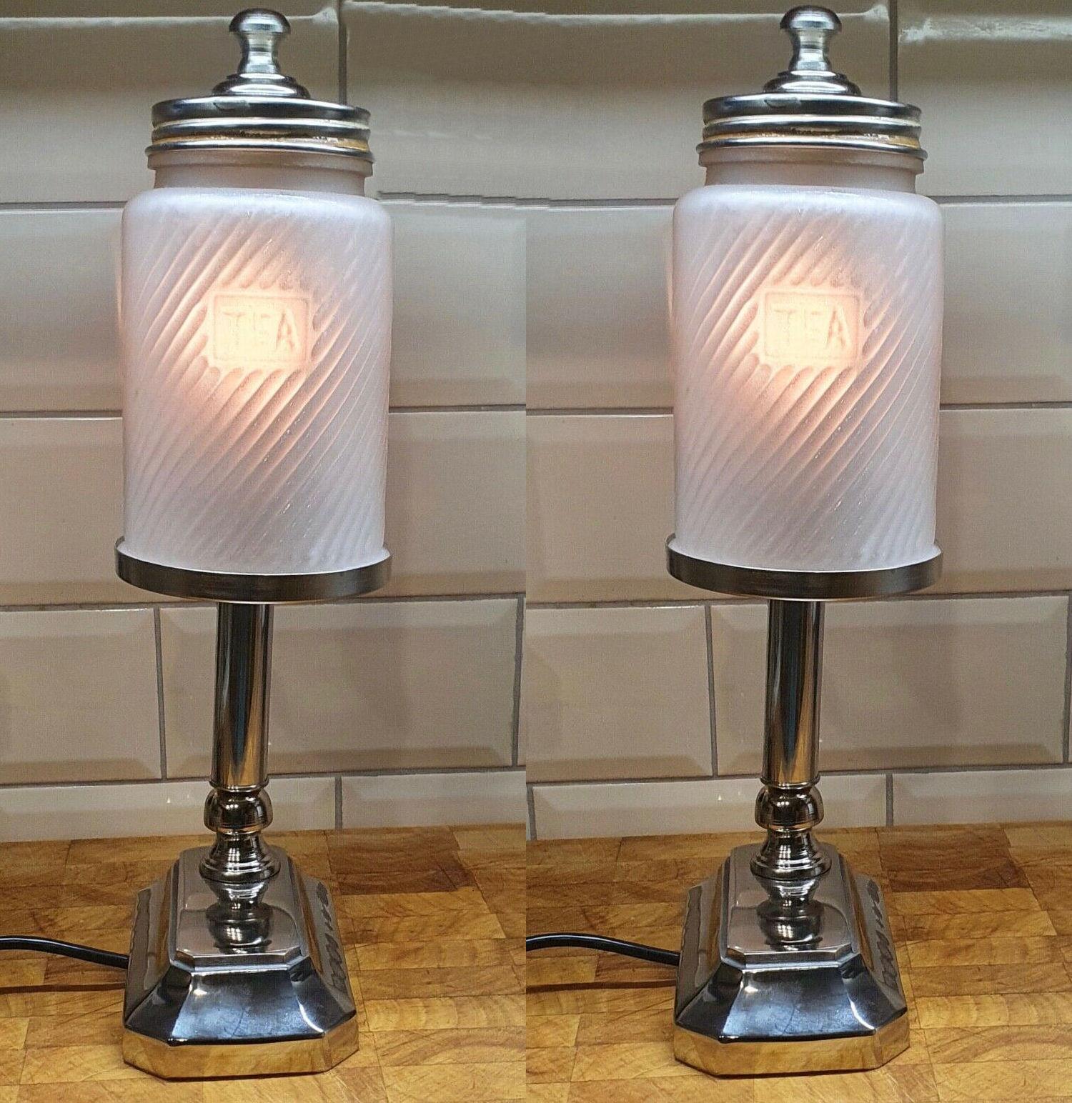 This is a perfect opportunity to acquire a superbly stylish and quite tall matching pair of unique Art Deco style chrome table lamps, with original tea glass shades from the 1930s. Not mass produced these are handmade and hand polished to a very