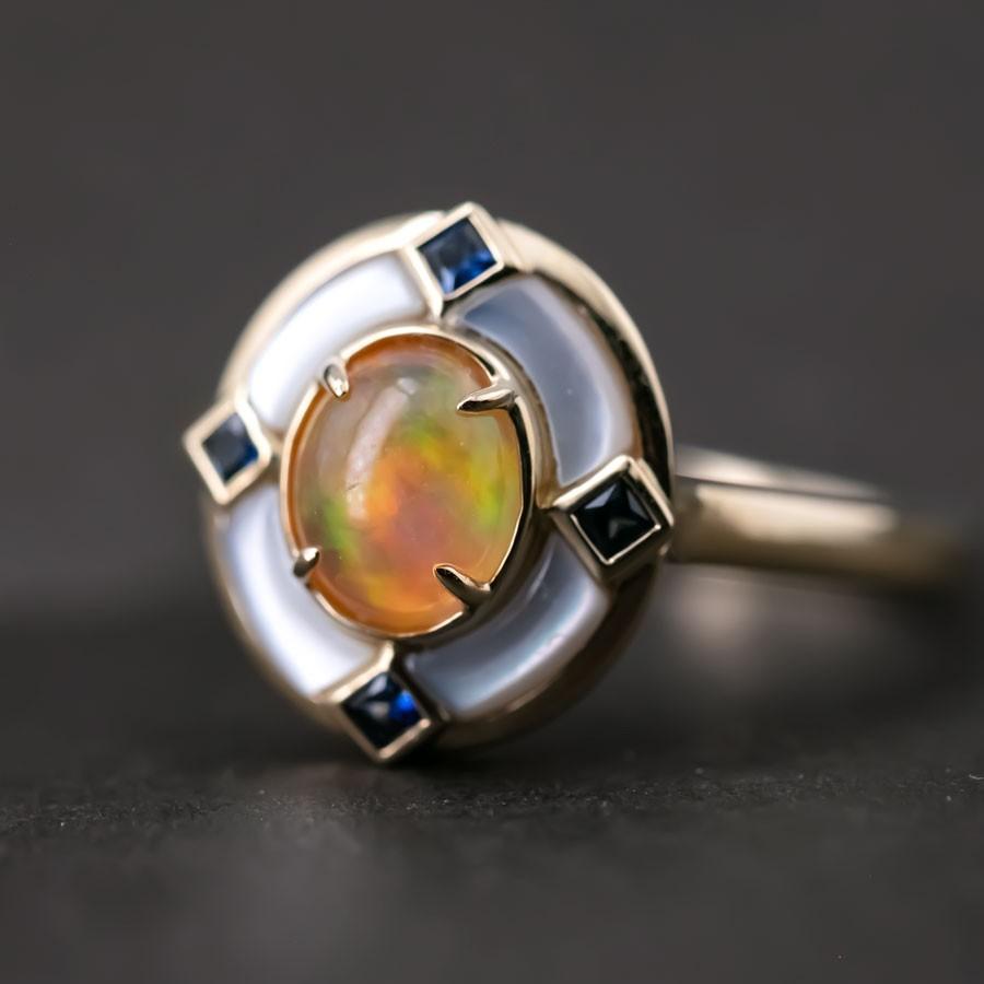 Art Deco Style Mexican Fire Opal Sapphire Engagement Ring 18K Yellow Gold.


Free Domestic USPS First Class Shipping! Free Gift Bag or Box with every order!

Opal—the queen of gemstones, is one of the most beautiful gemstones in the world. Every