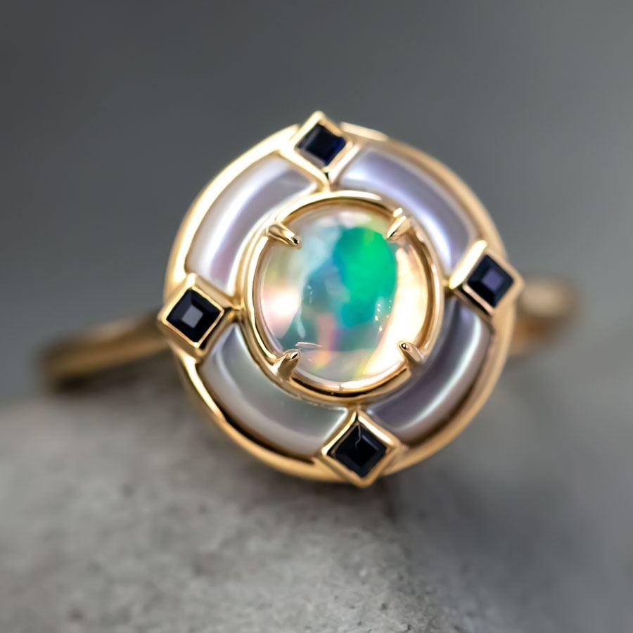 Art Deco Style Mexican Fire Opal Sapphire Engagement Ring 18K Yellow Gold.


Free Domestic USPS First Class Shipping! Free Gift Bag or Box with every order!

Opal—the queen of gemstones, is one of the most beautiful gemstones in the world. Every