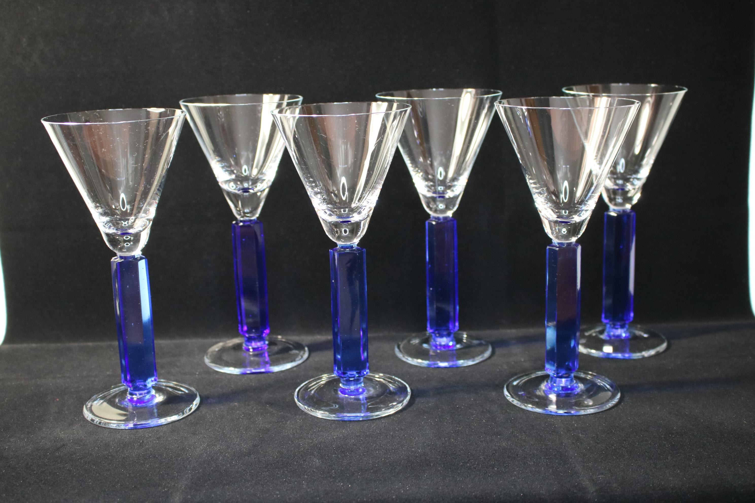 A beautiful and one of a kind set of 6 wine glasses. These were a part of a prototype production run, we were able to save these 6 pieces as the rest was destroyed. The material is sodium potassium glass.