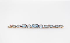 Art Deco Style Modern Round Cut Ruby Mixed Cut Blue Topaz Yellow Gold Bracelet