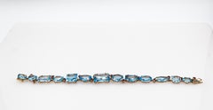 Art Deco Style Modern Round Cut Ruby Mixed Cut Blue Topaz Yellow Gold Bracelet