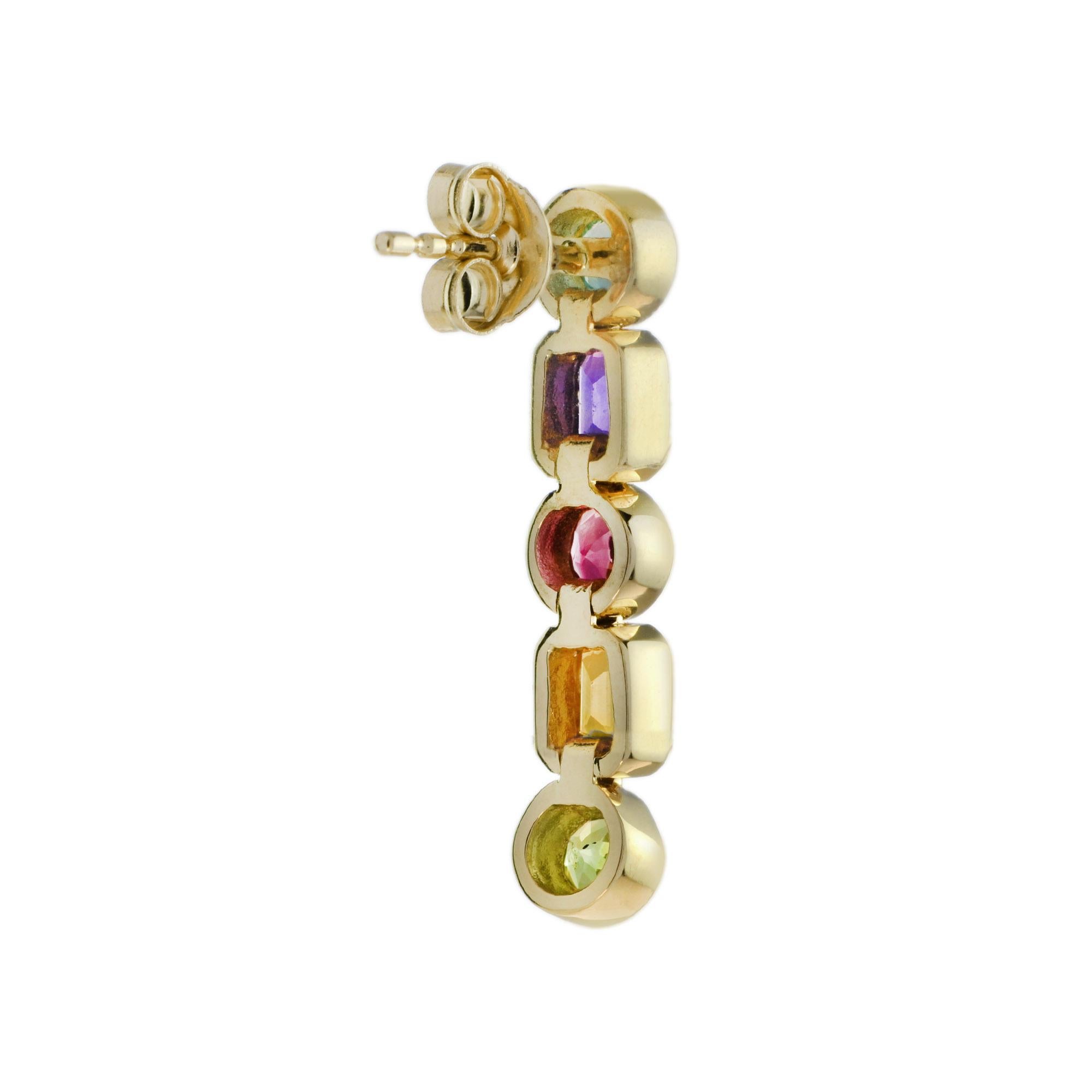 Art déco Boucles d'oreilles pendantes en or jaune 14 carats, composes de cinq pierres prcieuses. en vente