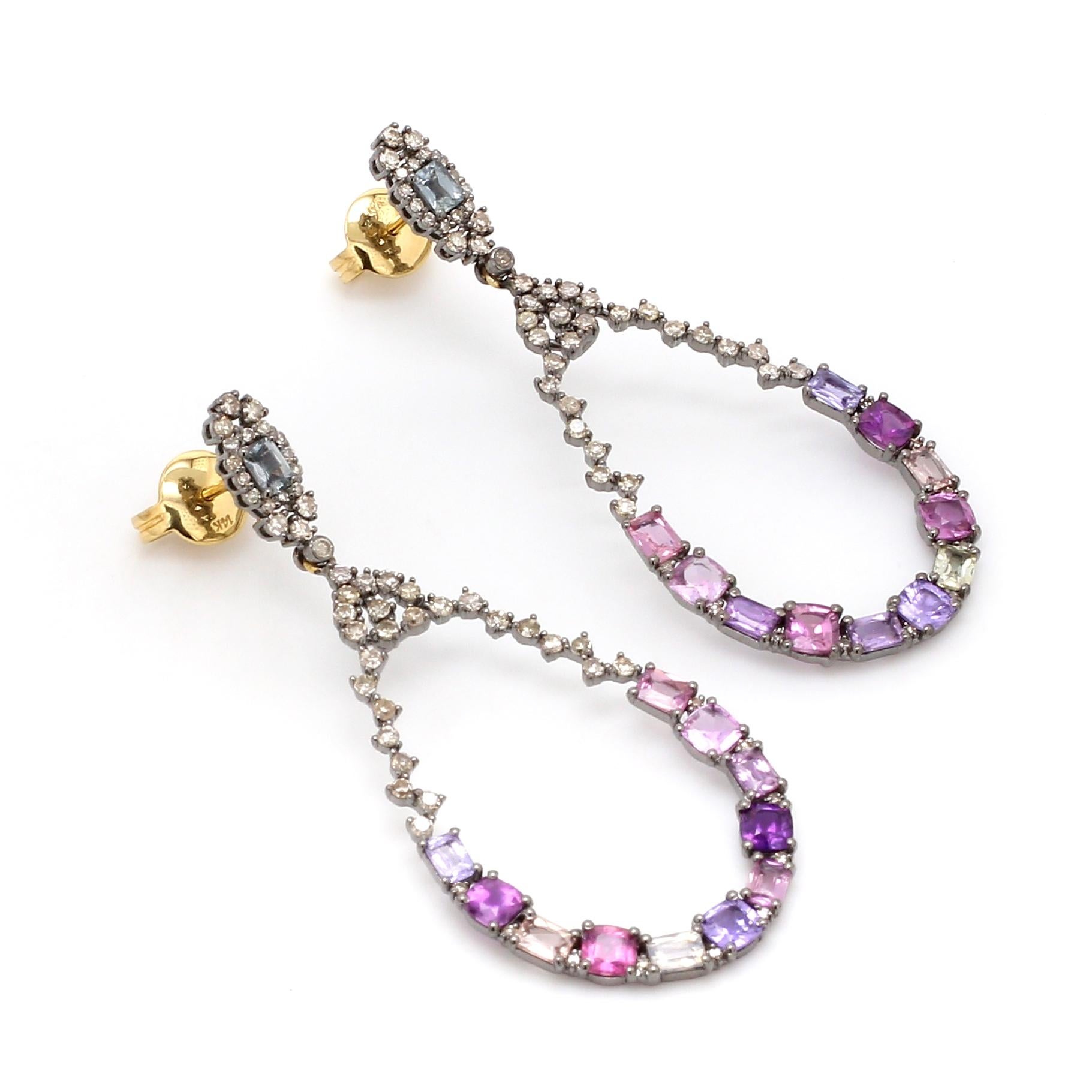 Art-Deco Style Multi-Sapphire and Diamond Pear-Shape Drop Earrings 

This Victorian-era fascinating art-deco style multi-sapphire and diamond hanging earring is impressive. The earring is designed stylishly in the open teardrop look with the