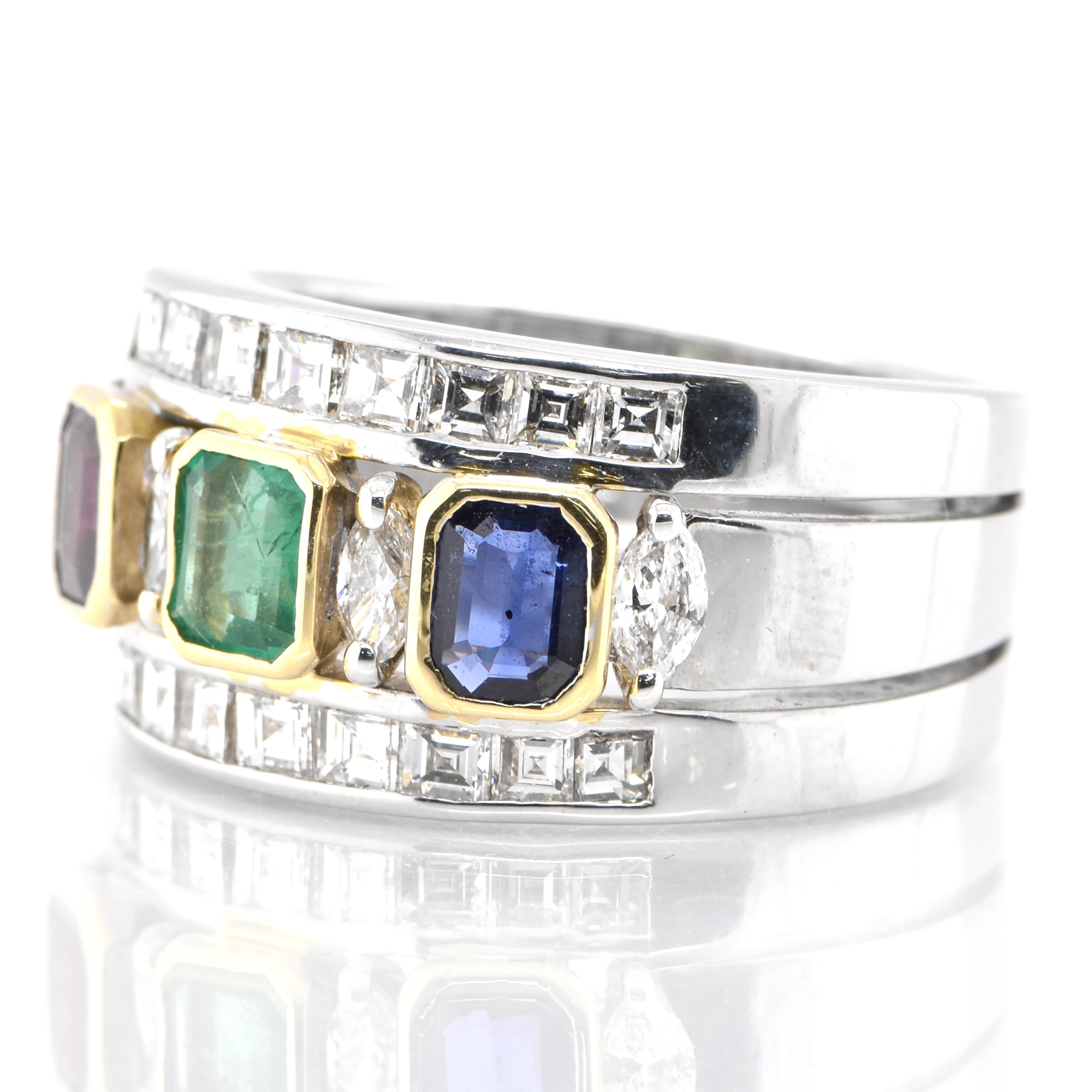 A stunning band ring featuring a total of 1.48 carats of Natural Emerald, Ruby and Sapphire and 1.33 Carats of Diamond Accents set in 18 Karat White Gold. People have admired emerald’s green for thousands of years. Emeralds have always been