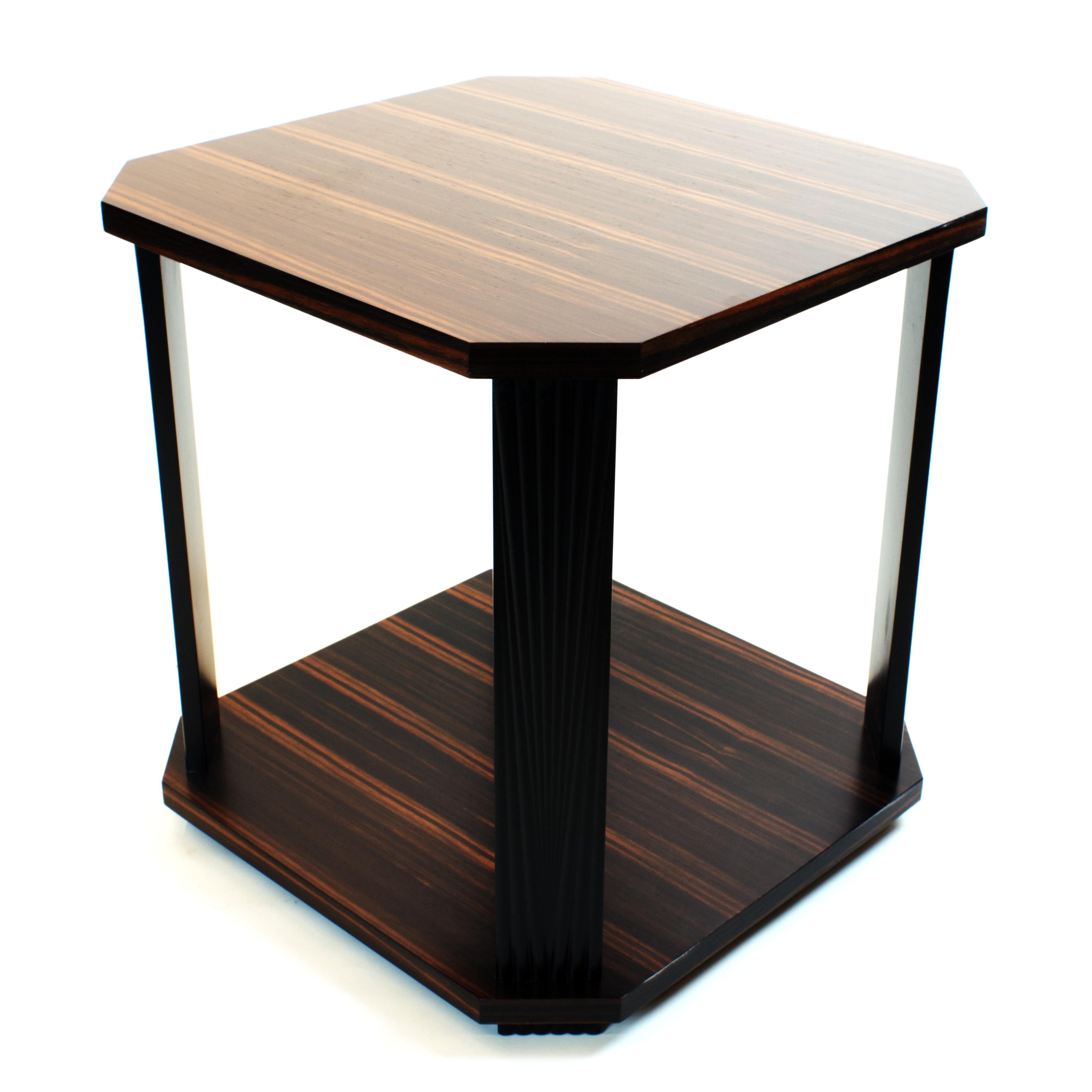 Art Deco inspired side table in genuine Ebony Macassar veneer. This reiteration of a classic design from 1930s is available in various exotic veneers and finishes with fully customizable size to complement your interiors. Minimalistic shape of the