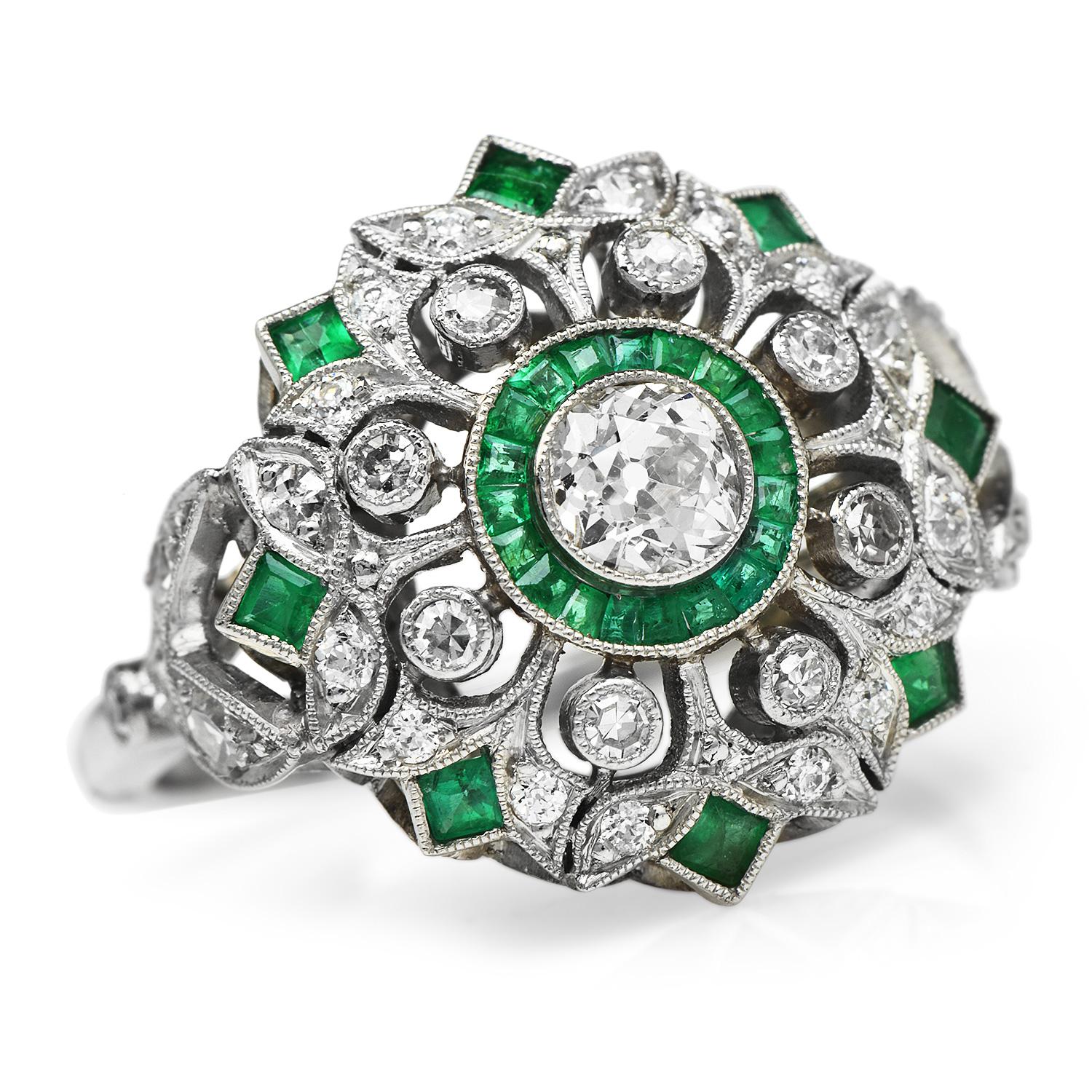 This art deco design ring boasts vibrance and color, all while 

Offers a beautiful art deco pattern crafted in Platinum.

Featuring an Old European cut Diamond center and accented

With an old-cut Diamond and calibrated French-cut Emerald.

Total