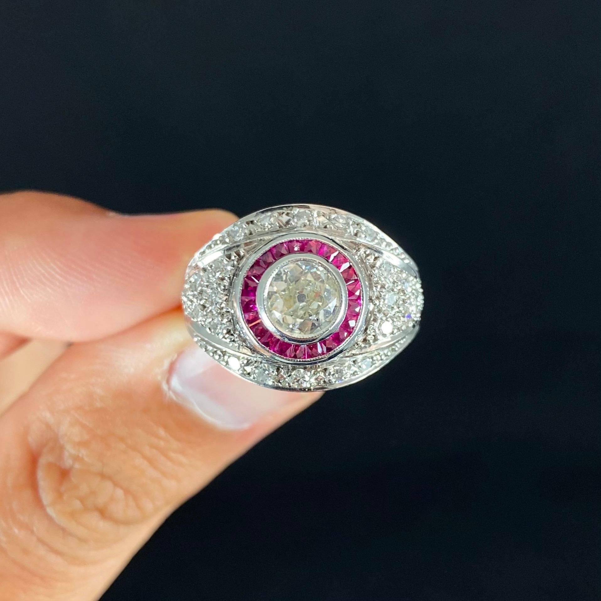 Art Deco style Old European brilliant-cut diamond and ruby bombe target engagement ring in 18 karat white gold, circa 1990. This ring of a target design very typical of high cocktail and dress jewelry from the 1920s and 1930s features an Old