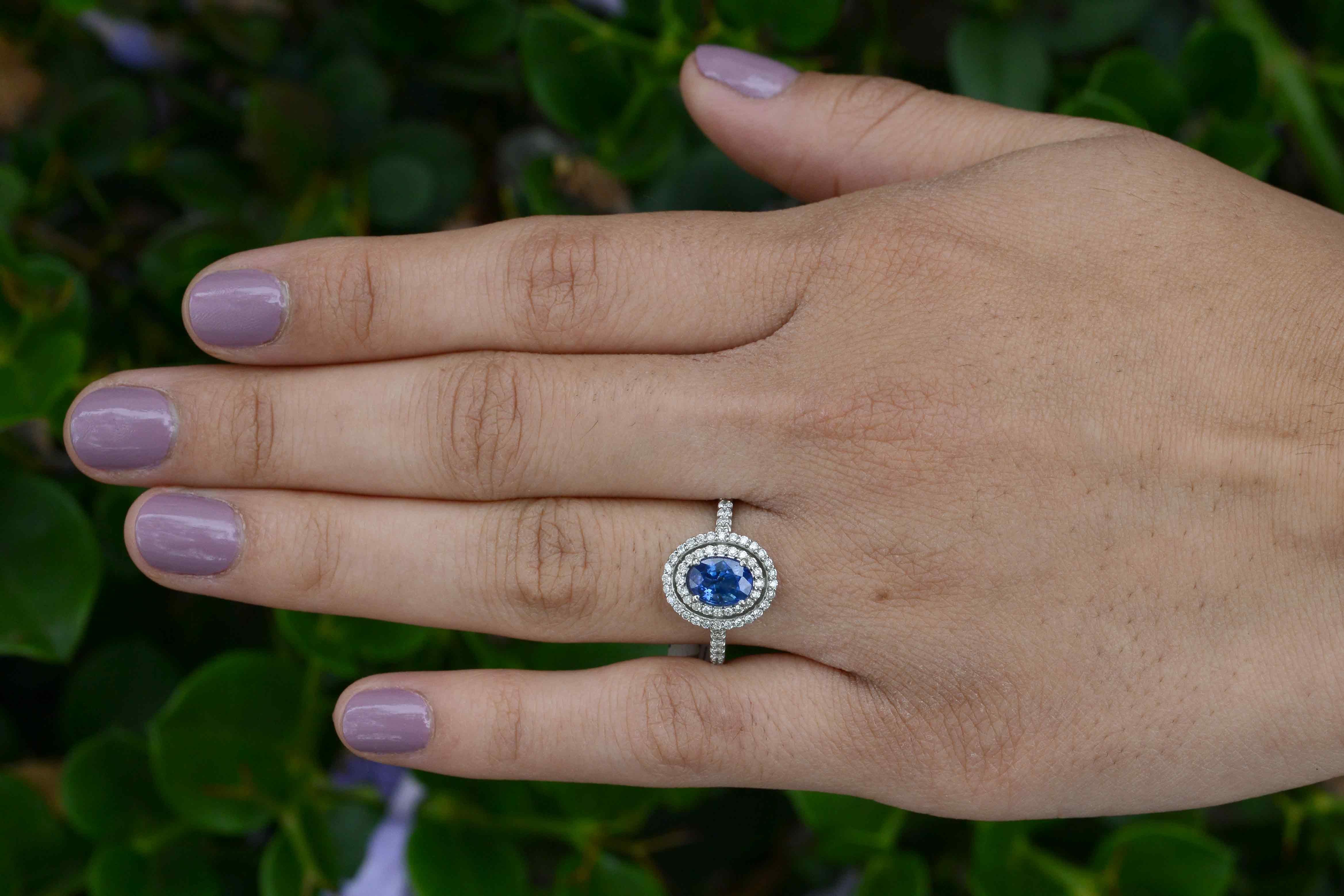 This Art Deco inspired design features a lustrous, 1.15 ct sapphire of rich, velvety blue with amazing clarity. Set off magnificently by 3/4 carats of fiery and sparkling round brilliant cut diamonds in a 3 tier pave' double halo and band. 

Why