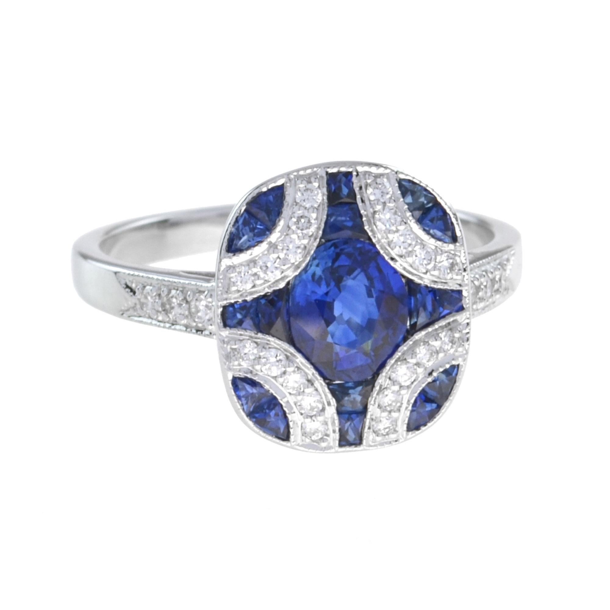 Sapphire and diamond Art Deco-inspired ring with seventeen sapphires totaling 1.92 carats. This design features an oval cut sapphire center with adjacent French trapezoid cut sapphire and prong set round white diamonds totaling 0.19 carats. 14K