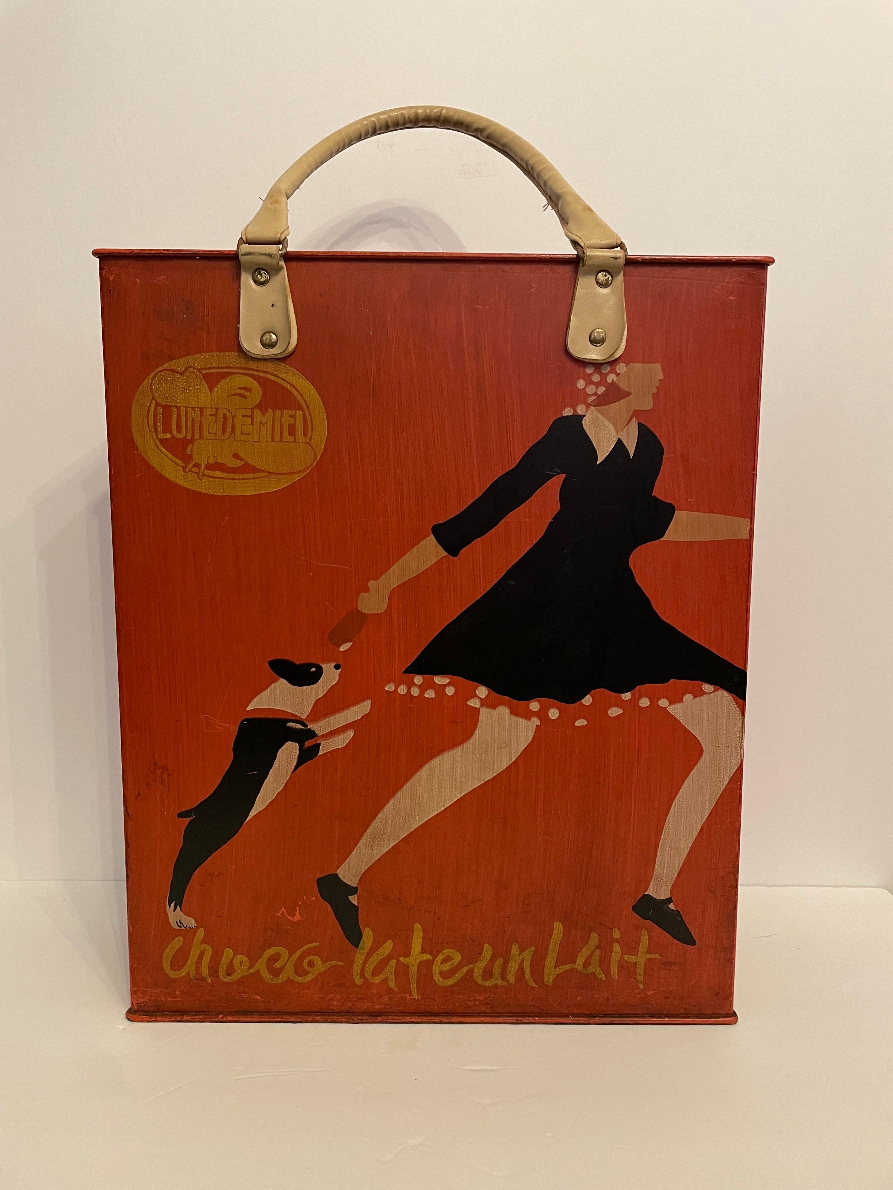 Art Deco style Umbrella stand in the form of a shopping bag. In gold neat handle is Lunedemiel (Honey Moon) and near bottom is Chocolate au Lait Painted on both sides. Measures 14