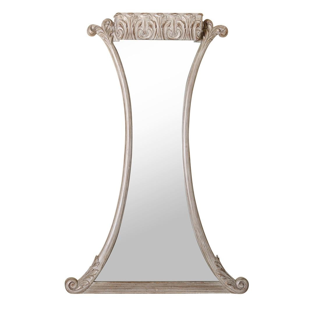 An Art Deco style painted trompe l'oeil mirror and wall mount console. The demi-lune console table is topped with an antiqued mirror and a curved apron is carved with faux tassels, and supported with a single pedestal. The slender shaped mirror