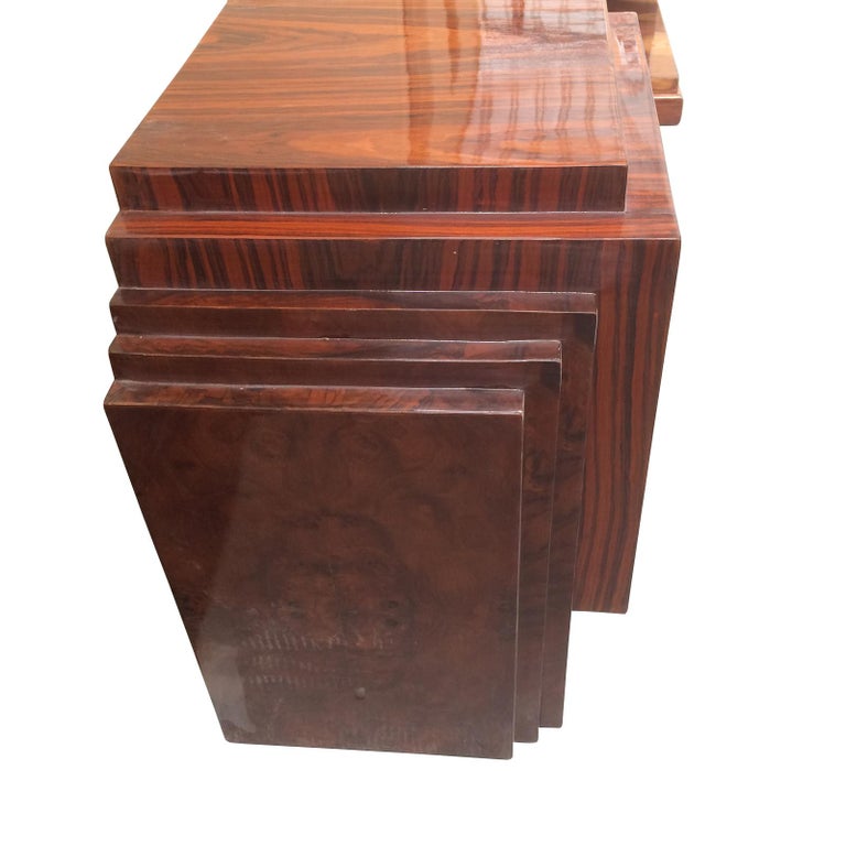 Art Deco Style bedside tables stepped Macassar with three draws to each. An outstanding design with geometric step to around the top, and a further four steps to both sides of each cabinet. Each draw has a central, spherical chrome knob and the