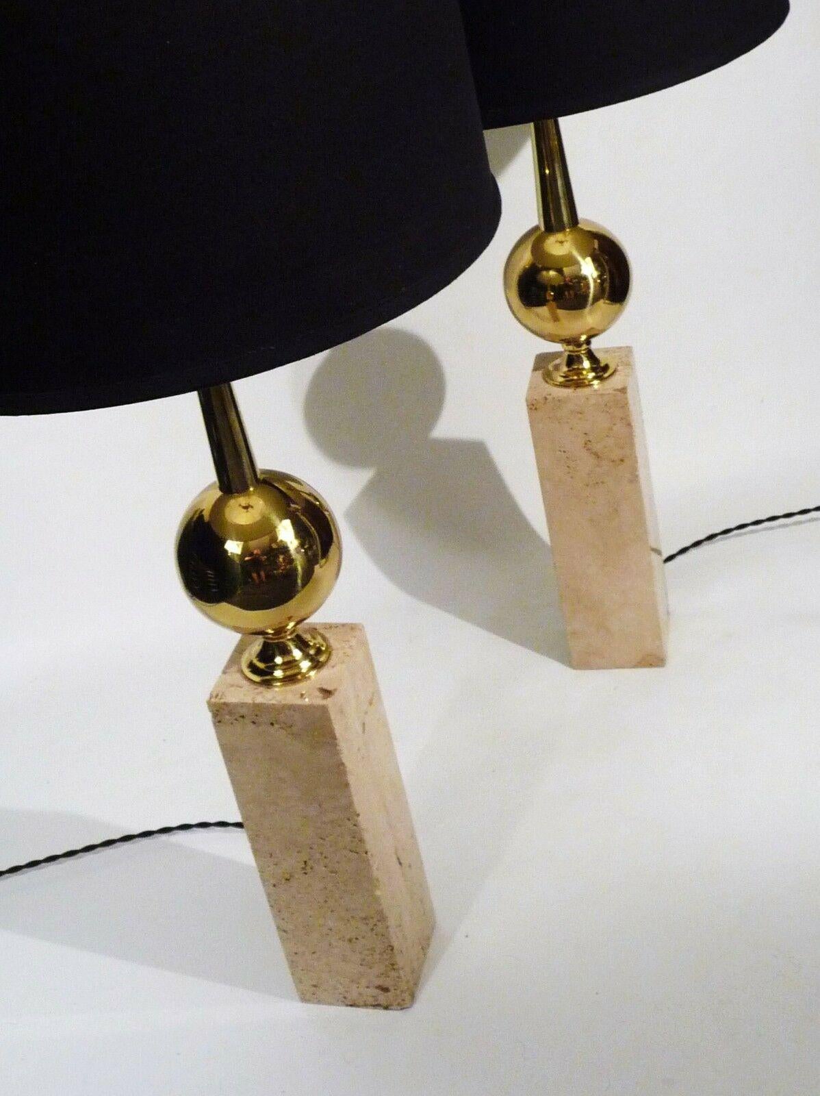 For your consideration is this pair of natural travertine and brass sphere Barbier style mid century modern classic regency table lamps. Brass elements have been re polished and both are newly rewired including premium sockets and twist wire