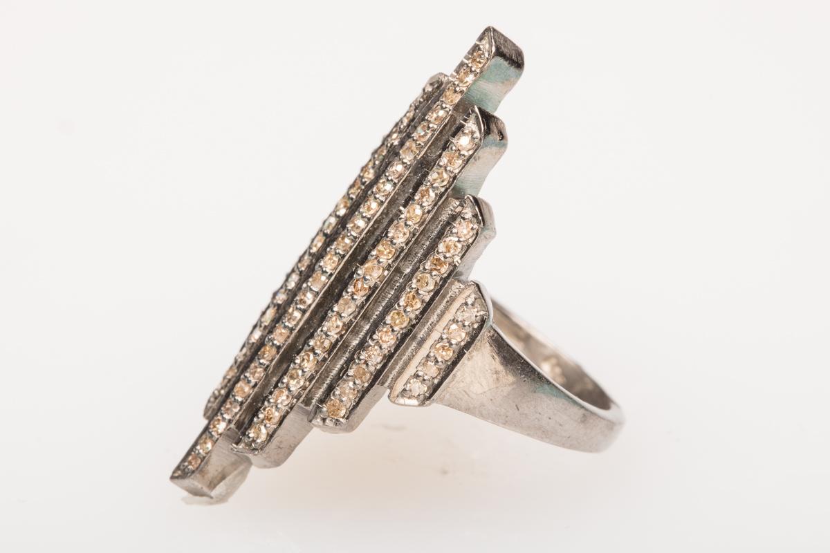Set in an oxidized sterling silver, an Art Deco style ring with pave`-set diamonds.  Diamond weight is .55 carats.  Ring size is 7.