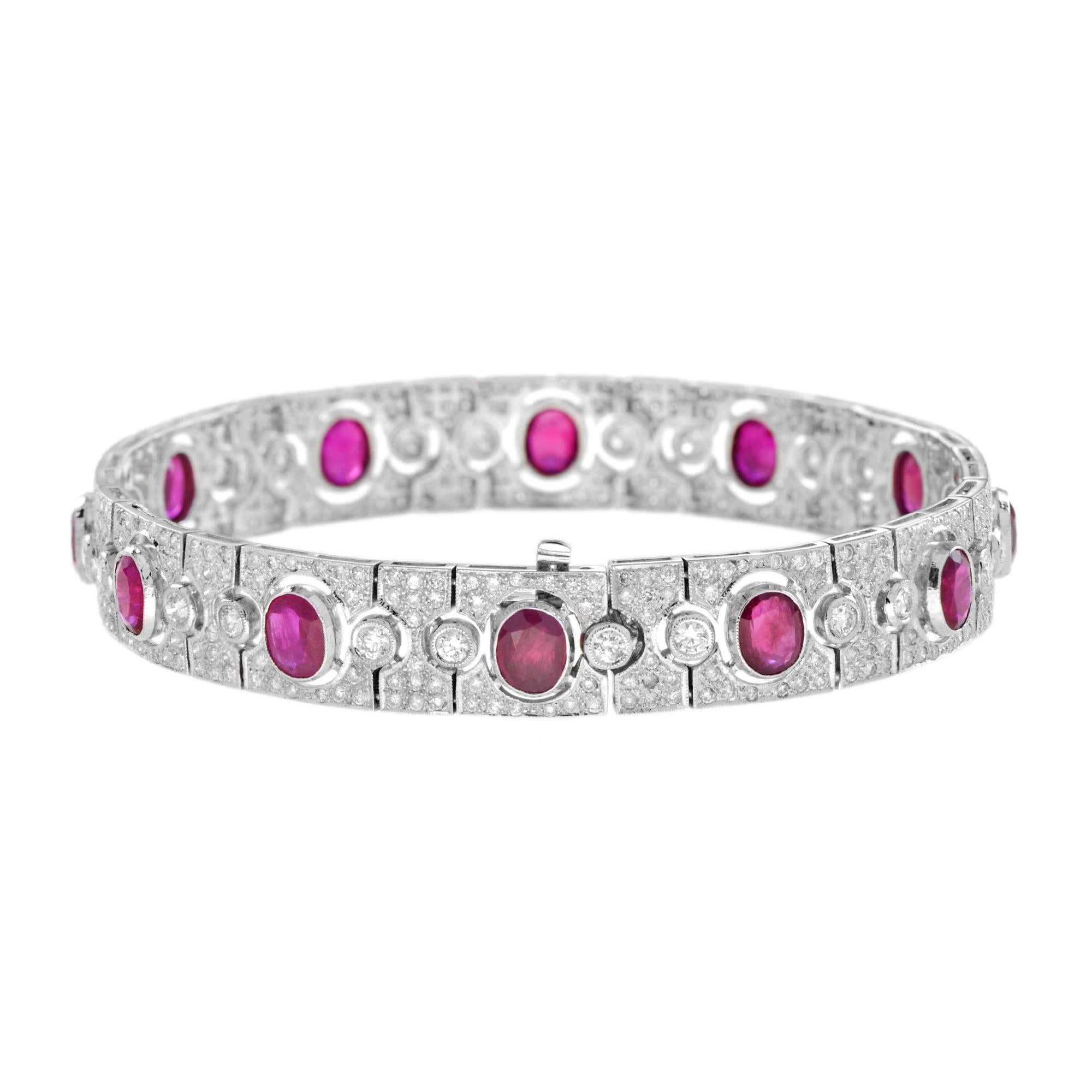 This stunning, fine and impressive antique style ruby bracelet with diamonds is crafted in 18k white gold. The fully articulated bracelet is composed of twelve oval rubies and 384 round brilliant diamonds. This wonderful piece is a must-have for any