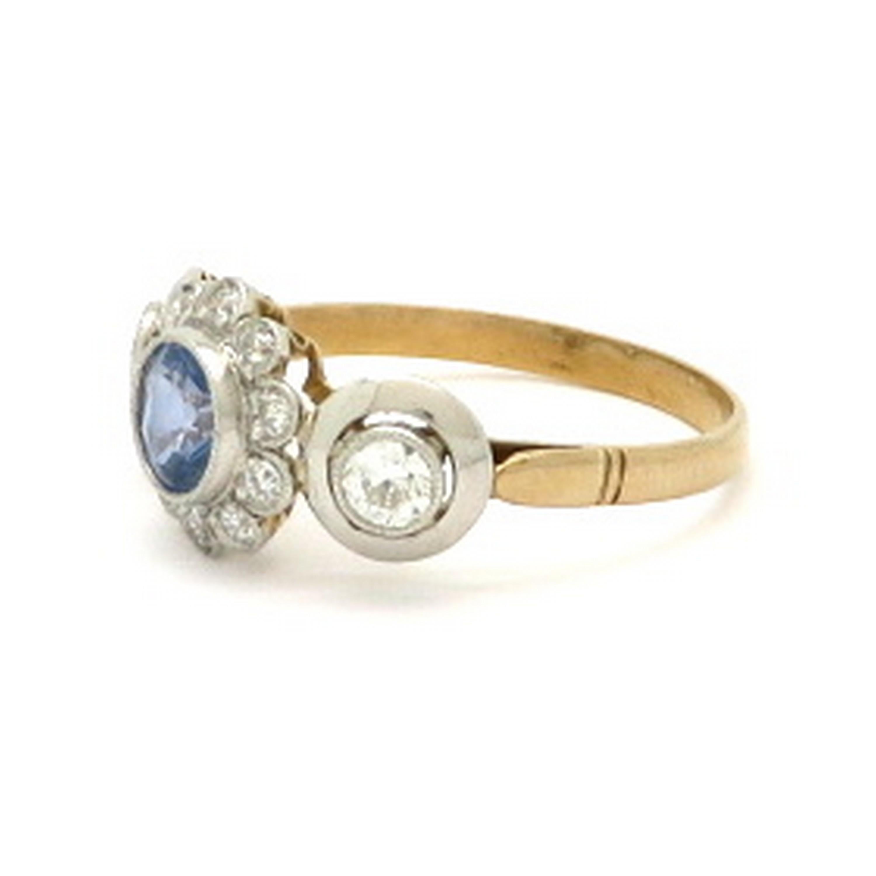 Art Deco style platinum and 18K two-tone flower sapphire and diamond ring. Showcasing one round brilliant cut light blue fine quality sapphire, milgrain bezel set, weighing approximately 0.80 carats. Interspersed with 10 Old European cut diamonds