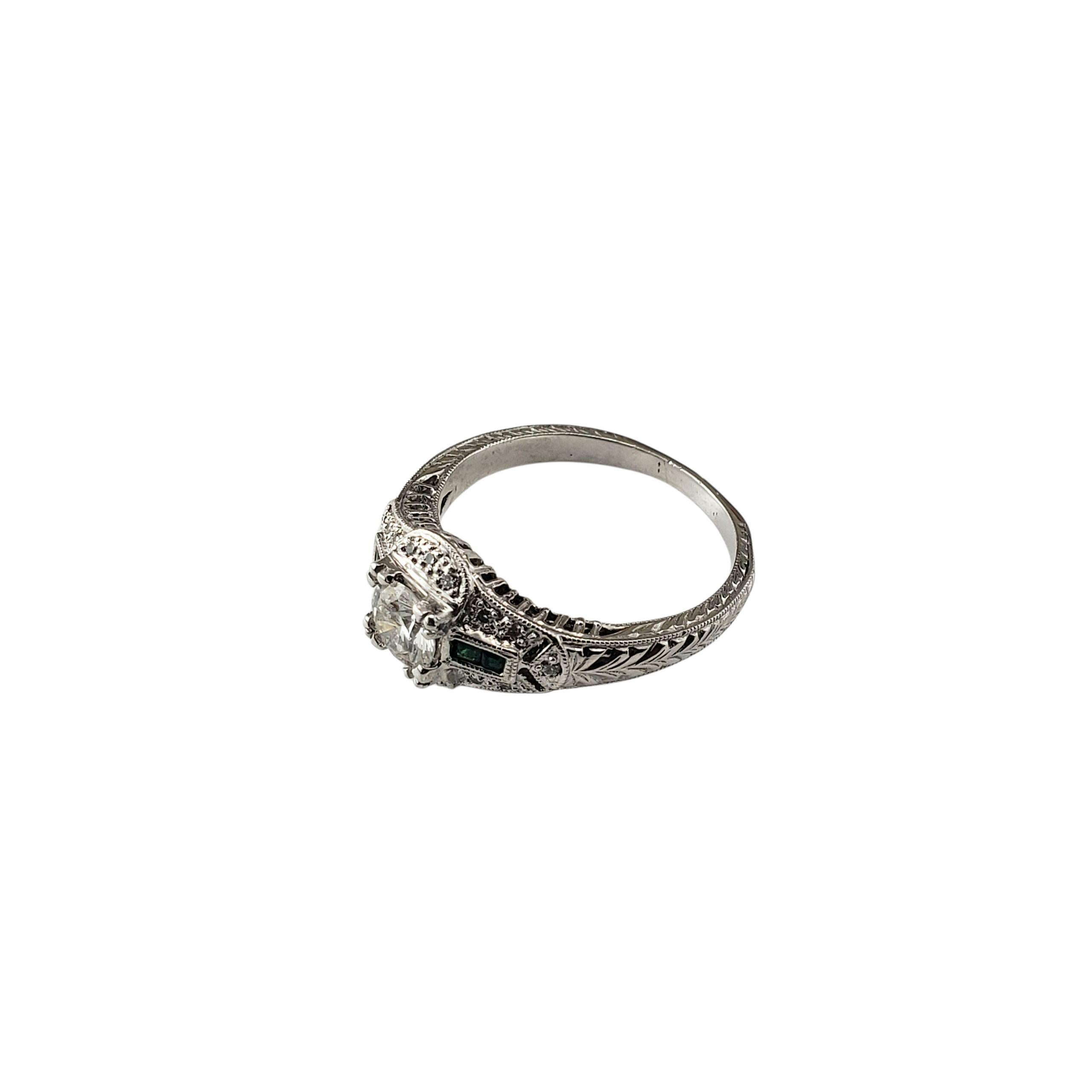 Art Deco Style Platinum and Diamond Engagement Ring Size 7.75

This striking Art Deco inspired platinum ring showcases a brilliant .58 ct. round diamond in an elegant milgrain setting. The shoulders are adorned with four green faceted inlaid stones