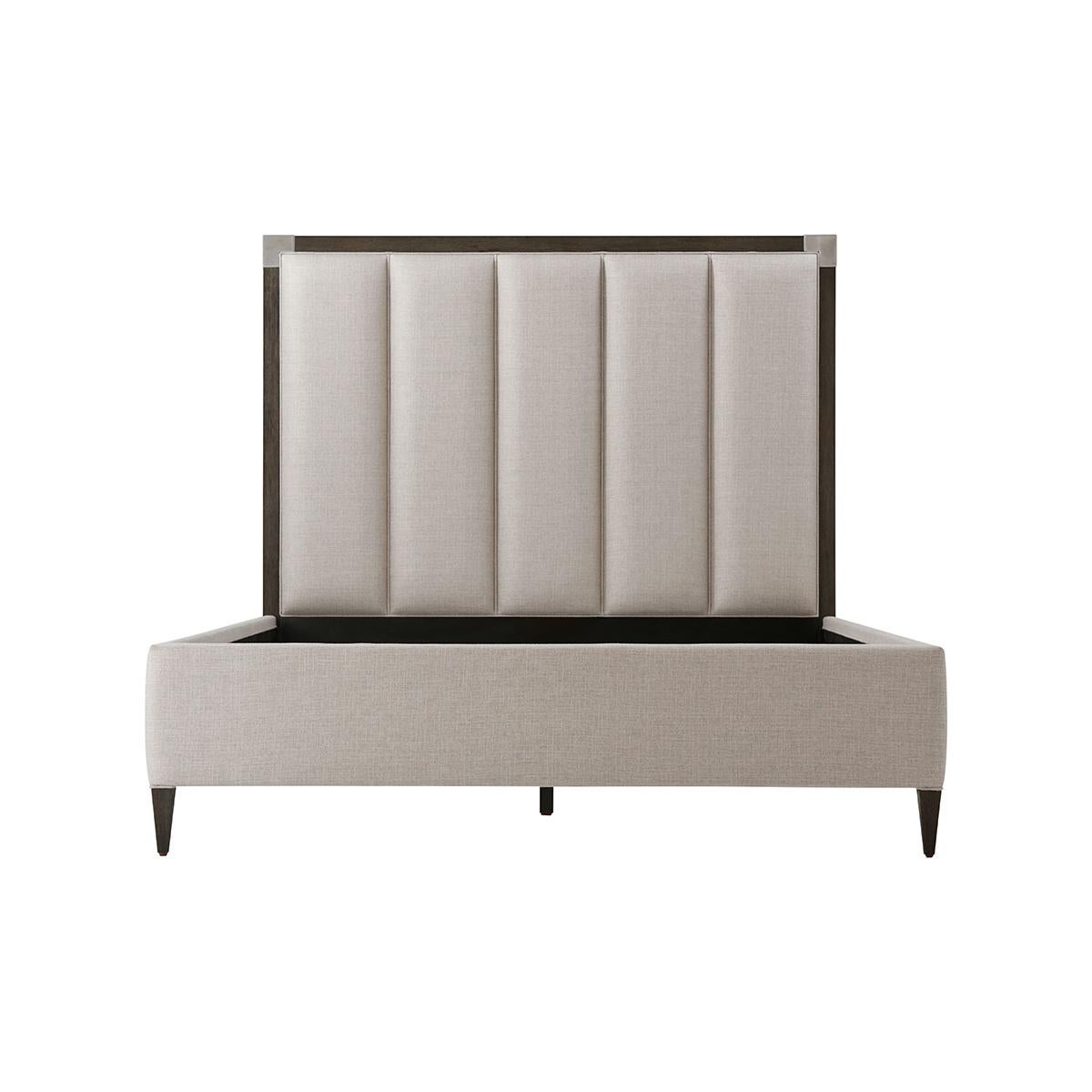 Art Deco Style Queen size bed with our Anise finish frame and brushed Nickel finish corner mounts with a vertically channeled upholstered headboard, upholstered rails and raised on tapered legs.


Dimensions: 64.25