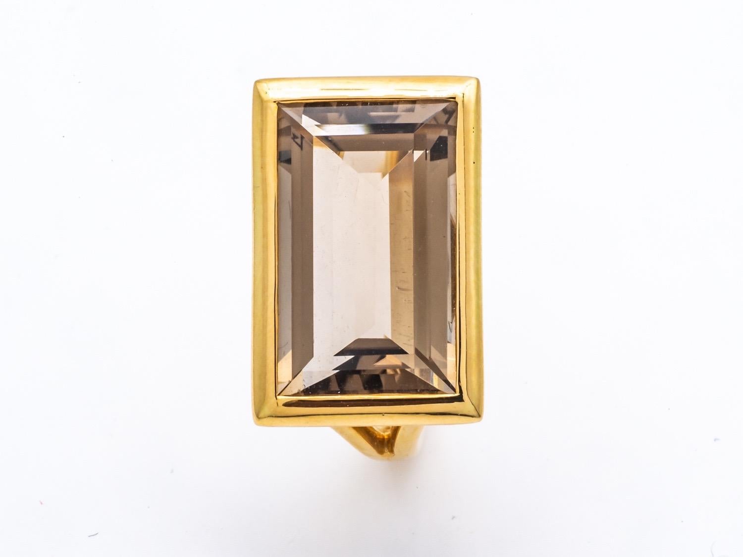 Art Deco Style Ring in 18K Yellow Gold set with an Emerald Size Smoked Quartz
the stone set closed gives all the modernity to this ring .
French size 53
 size US 6.75
weight of gold 7 grams