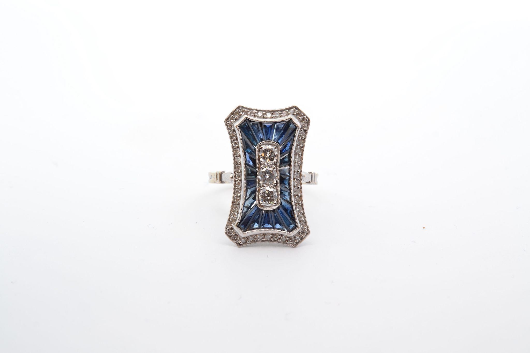 Stones: 51 diamonds: 1.05cts, 22 sapphires: 2.1cts
Material: 18k gold
Dimensions: 2.3cm x 1.4cm
Weight: 6g
Period: Recent
Size: 53 (free sizing)
Certificate
Ref. : 25178