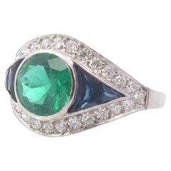 Art deco style ring with emerald, sapphires and diamonds