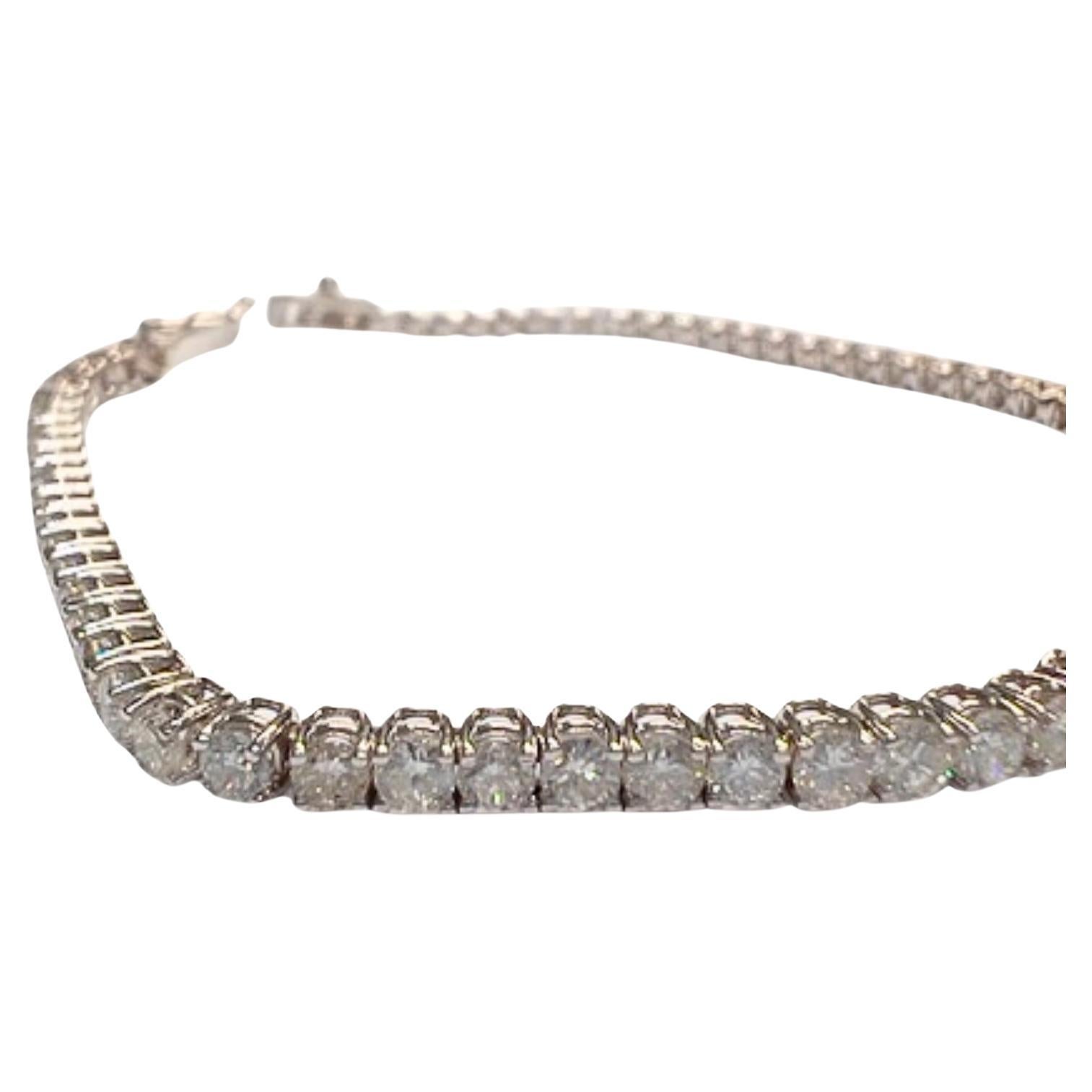 This bracelet showcases an Art Deco-inspired design, crafted in 18K white gold and adorned with brilliant-cut Diamonds. 
The Diamonds total 4.08 carats and are of VS-SI clarity and H-G color grade. 
It features a tongue clasp and measures 19 cm in