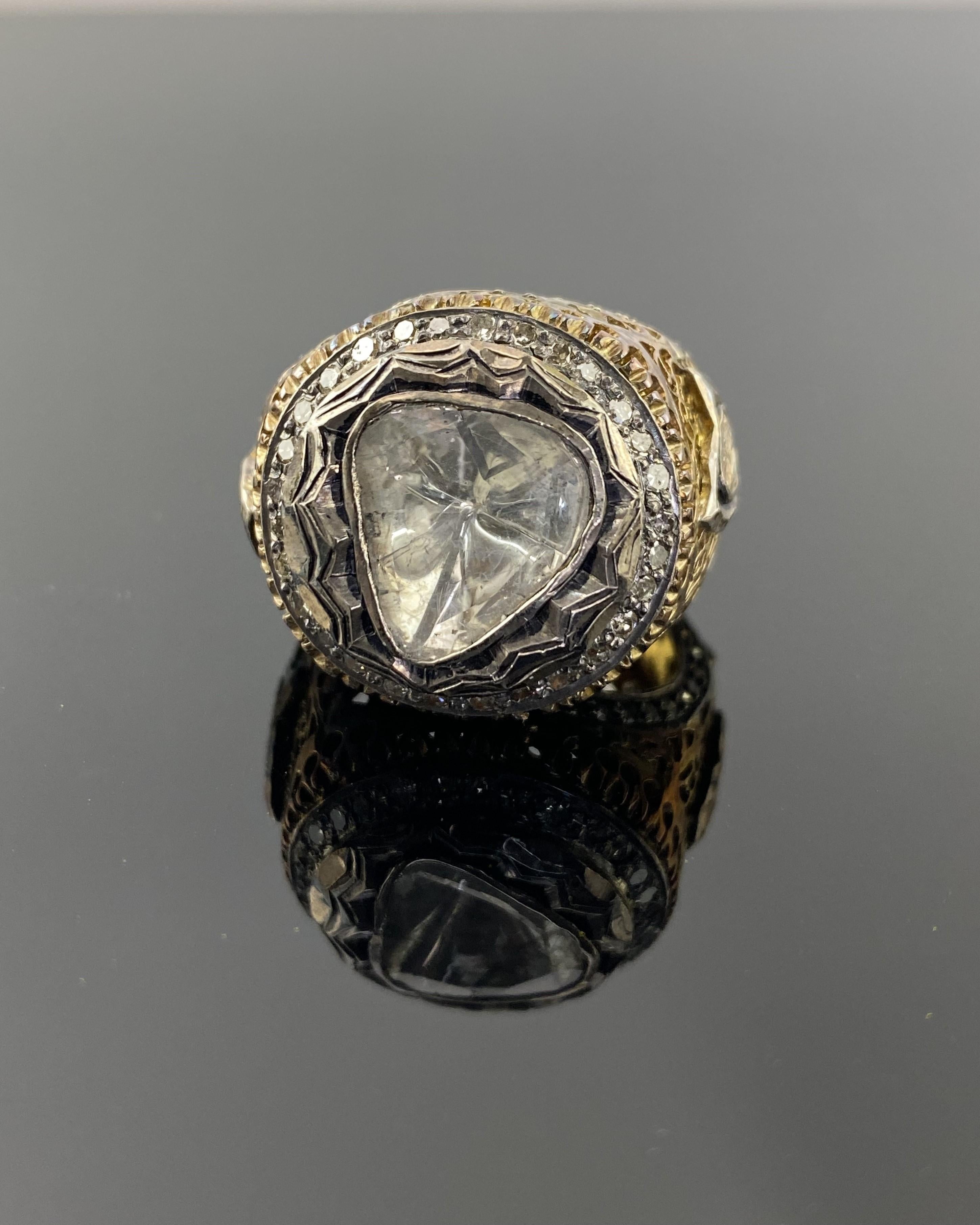 An intricate, hand made, rose cut center stone and full cut Diamond ring, set in 18k gold and silver mix.
We accept returns, and provide free shipping. 
Please feel free to message us for more information. 