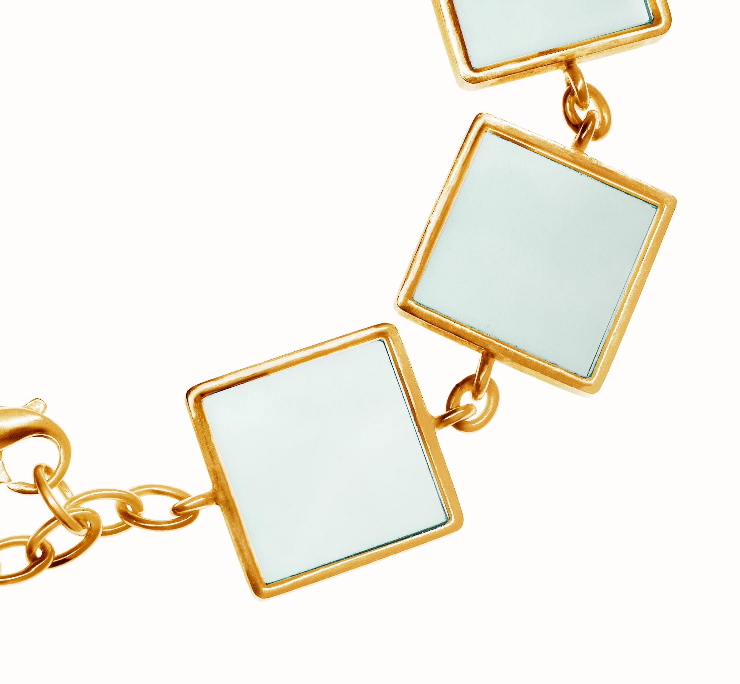 This contemporary link bracelet is made of 14 karat rose gold and features seven 15x15x3 mm grown green quartzes. It was designed by Berlin-based oil painter Polya Medvedeva and has been featured in Harper's Bazaar UA and Vogue UA.

The bracelet has