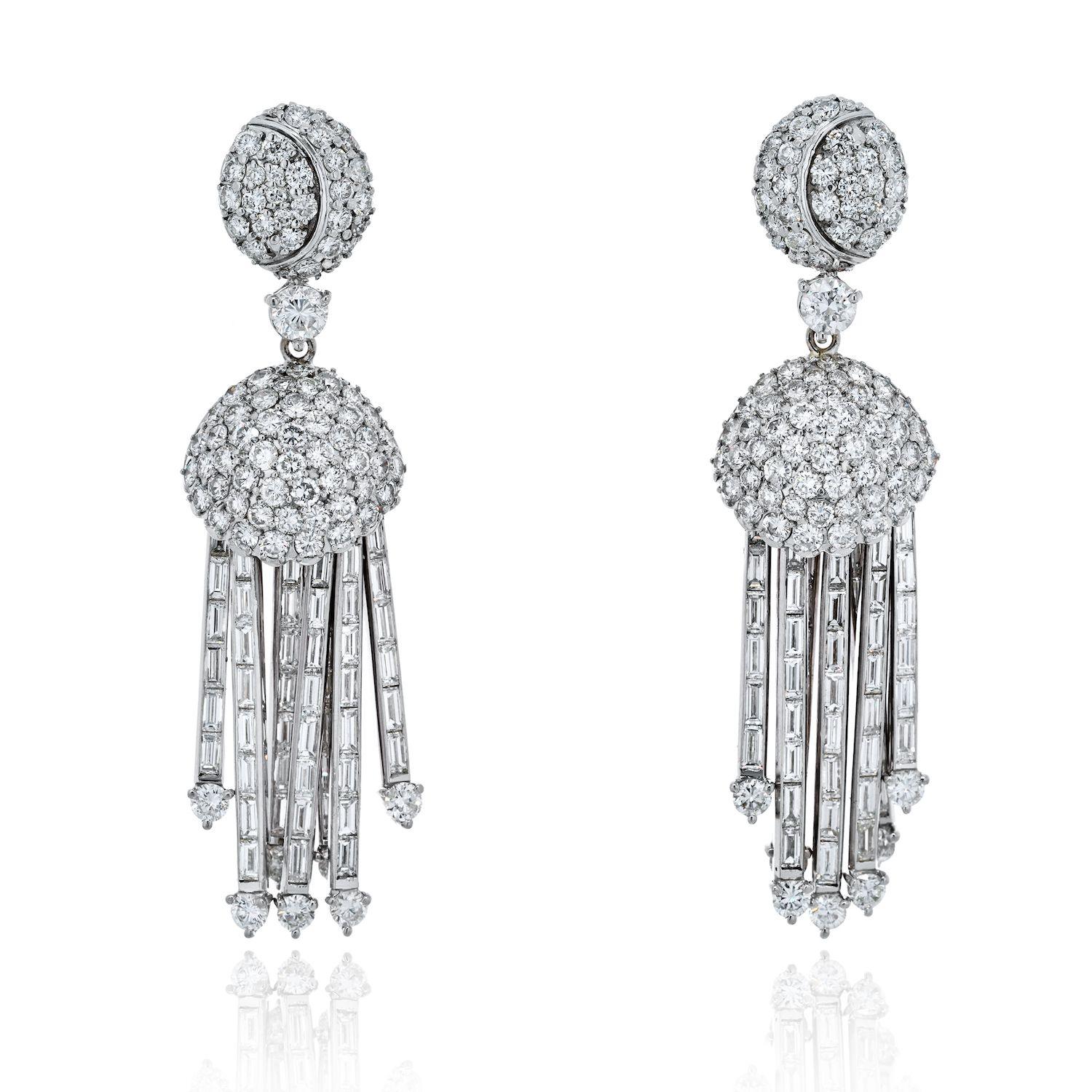 Elevate your style with these opulent 18K white gold dangling diamond earrings. These luxurious earrings are a true statement piece, boasting a remarkable 25 carats of round and baguette-cut diamonds meticulously set in a fabulous Art Deco-inspired