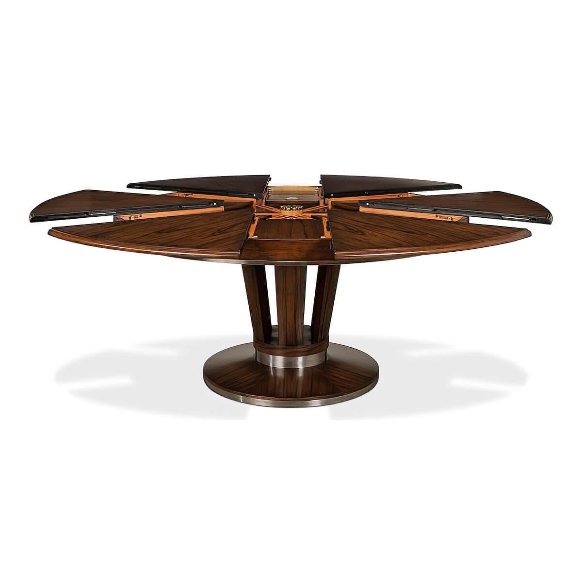 Art Deco Style extension table crafted of solid walnut and a Paldeo veneered top. The pedestal features six convex members resting on a circular base enhanced by antique stainless steel bands.

Dimensions: 84