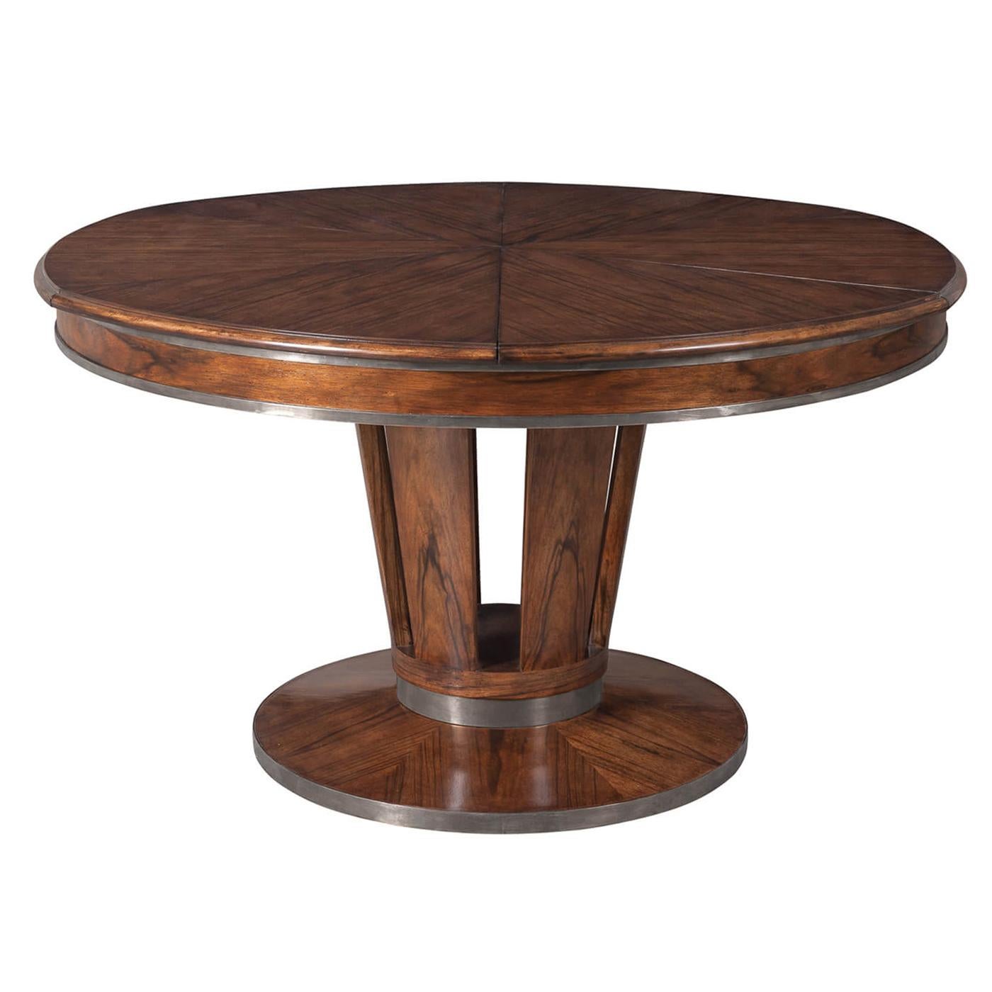 Art Deco style extension table crafted of solid walnut and a Paldeo veneered top. The pedestal features six convex members resting on a circular base enhanced by antique stainless steel bands.

Dimensions: 70