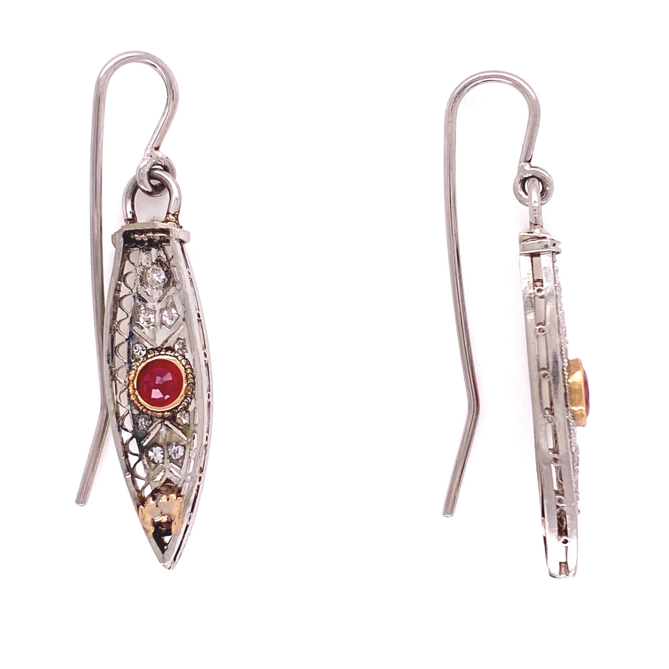 Simply Beautiful and finely detailed Drop Earrings, securely set with 2 rubies with approx. 0.40 total Carat weight and 0.12 total Carat weight Diamonds. Hand crafted Platinum detailed filigree and milgrain mounting. The earrings epitomize vintage