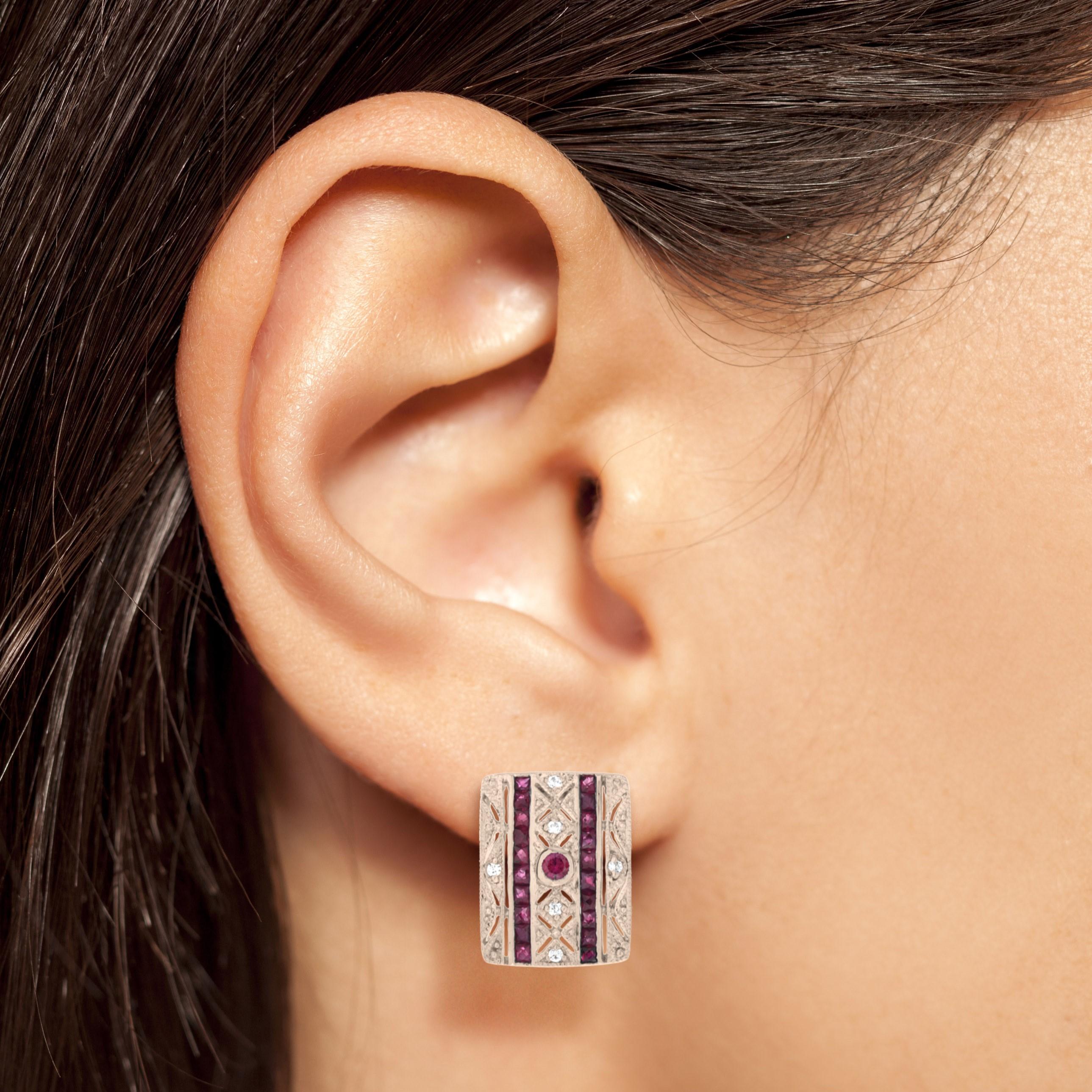 A beautiful pair of Art Deco style 14k rose gold millgrain and open work square shape stud earrings featuring 2 round and 40 French cut rubies with total of 0.06 carats diamonds. These simple and classic earrings are perfect to wear