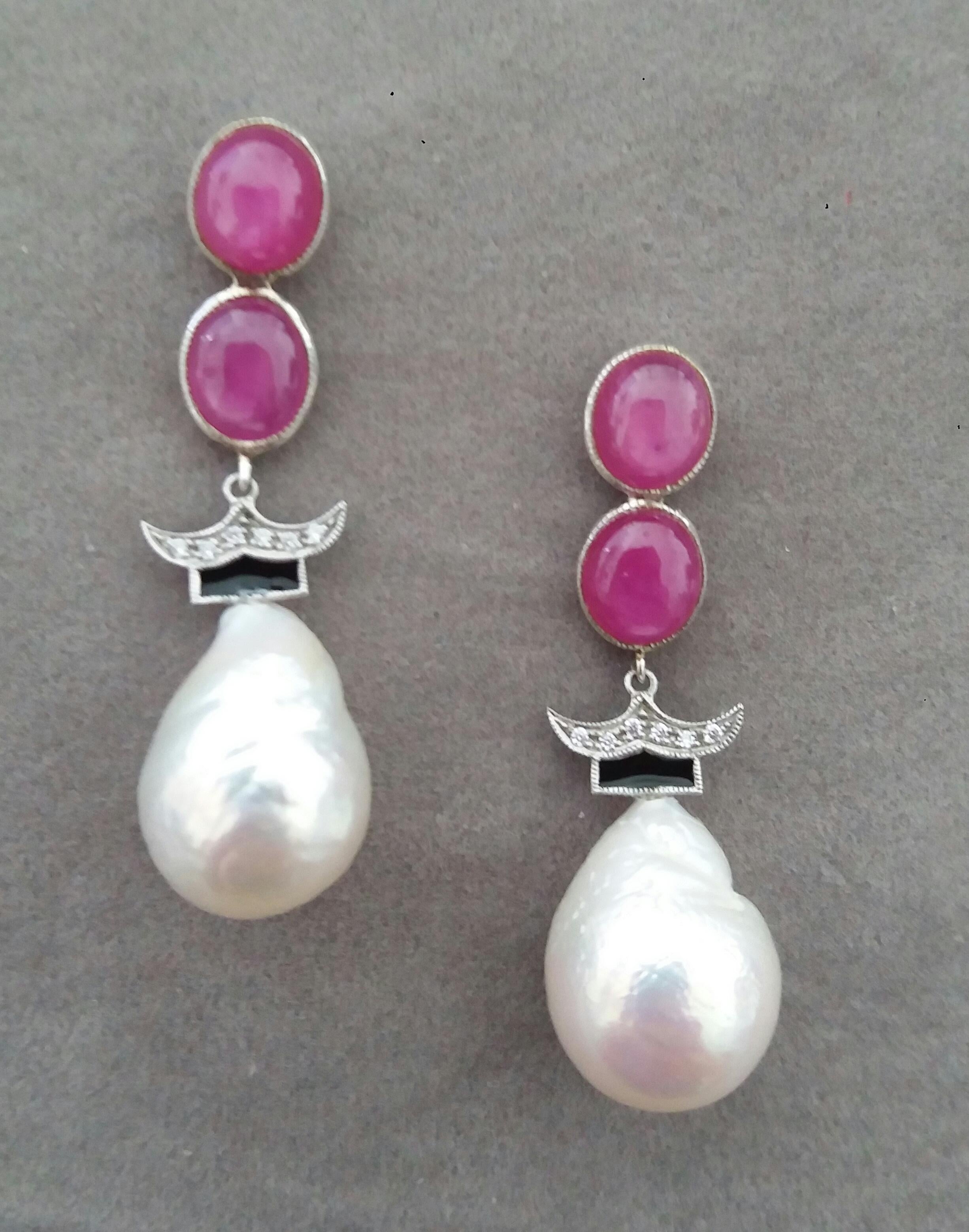 In these Classic Art Deco Style the tops parts have 4  ruby oval cabochons size 6x8 mm and a white gold element with 14 diamonds and black enamel , finally the bottom parts  are  composed of 2 white  baroque pearls measuring  13 x17  mm. 

In 1978