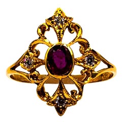 Anillo de cóctel de oro amarillo con diamantes talla brillante y rubí estilo Art Déco