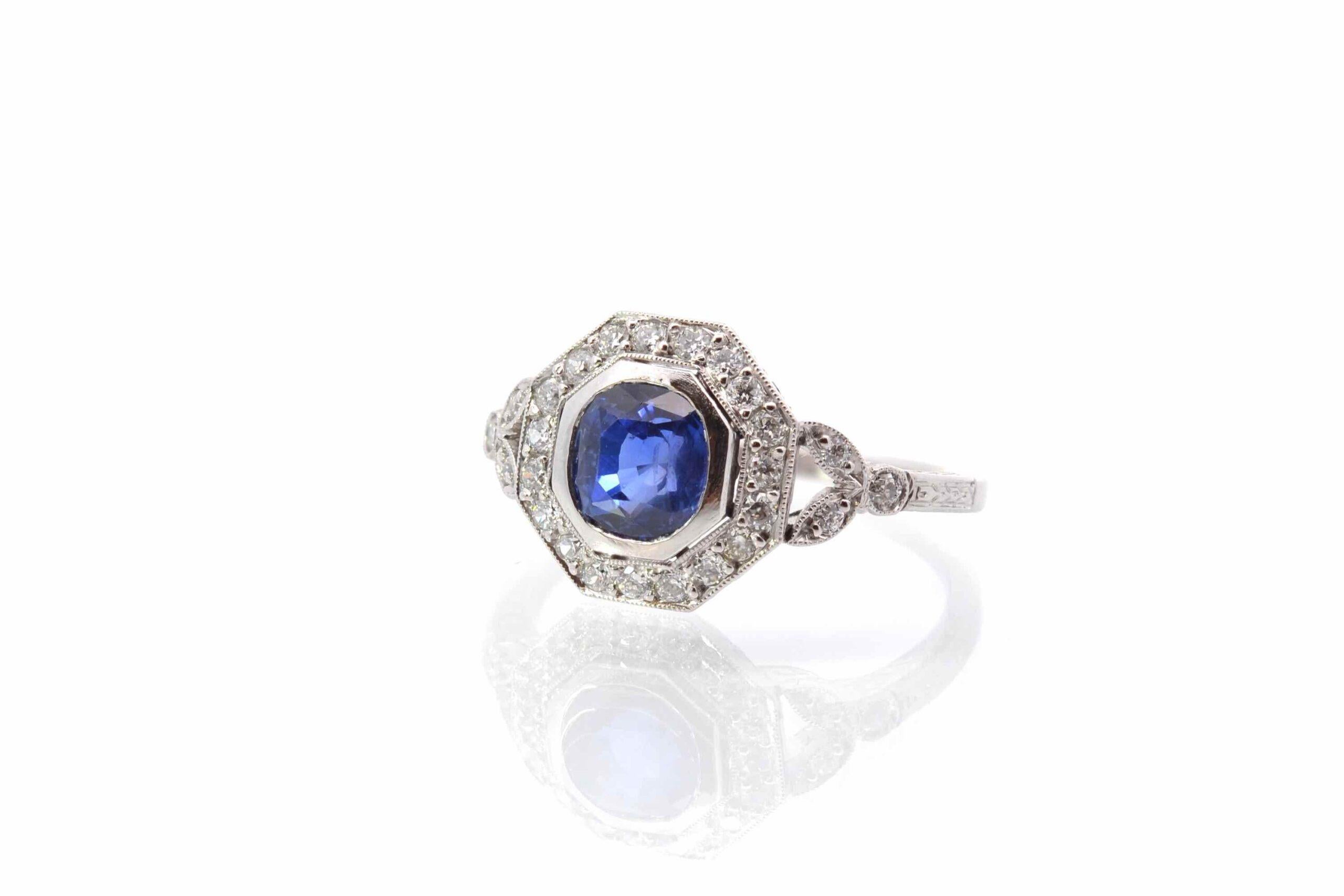 Oval Cut Art déco style sapphire and diamonds ring in platinum For Sale