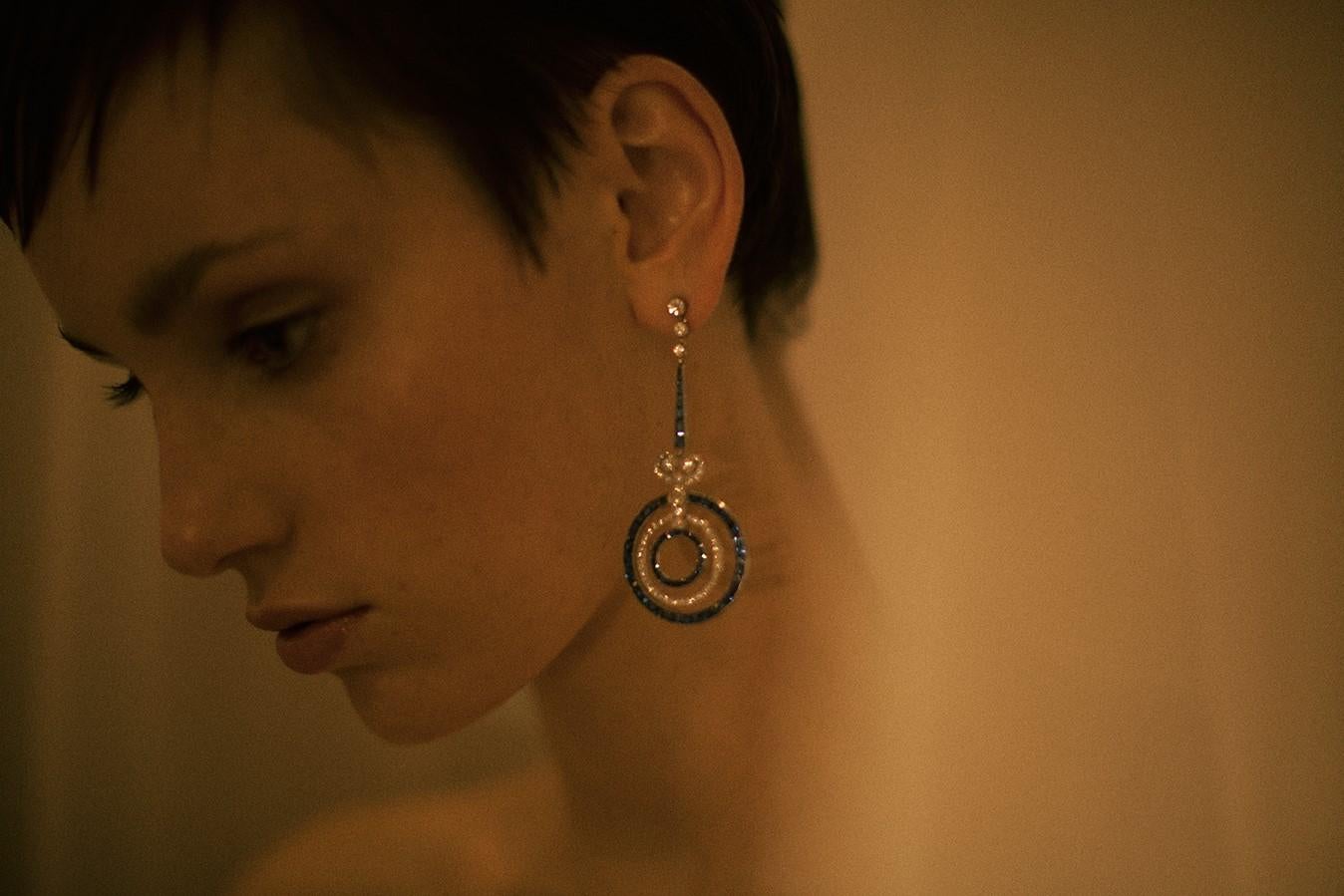 Extraordinary earrings crafted approximately in early to mid 20th century in Art Deco style.
950/0 platinum, circa 2.5 carats sapphires with intense color – medium to dark blue – matched to graduate perfectly and circa 1.5 carats of