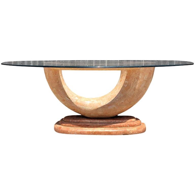 Pink Marble Serpentine dining table with oval glass top and sculptural waterfall base attributed to Karl Springer. Rare art deco or art nouveau mid-century modern pink laminate tessellated marble base shaped in a wonderful curved shape. 

The base